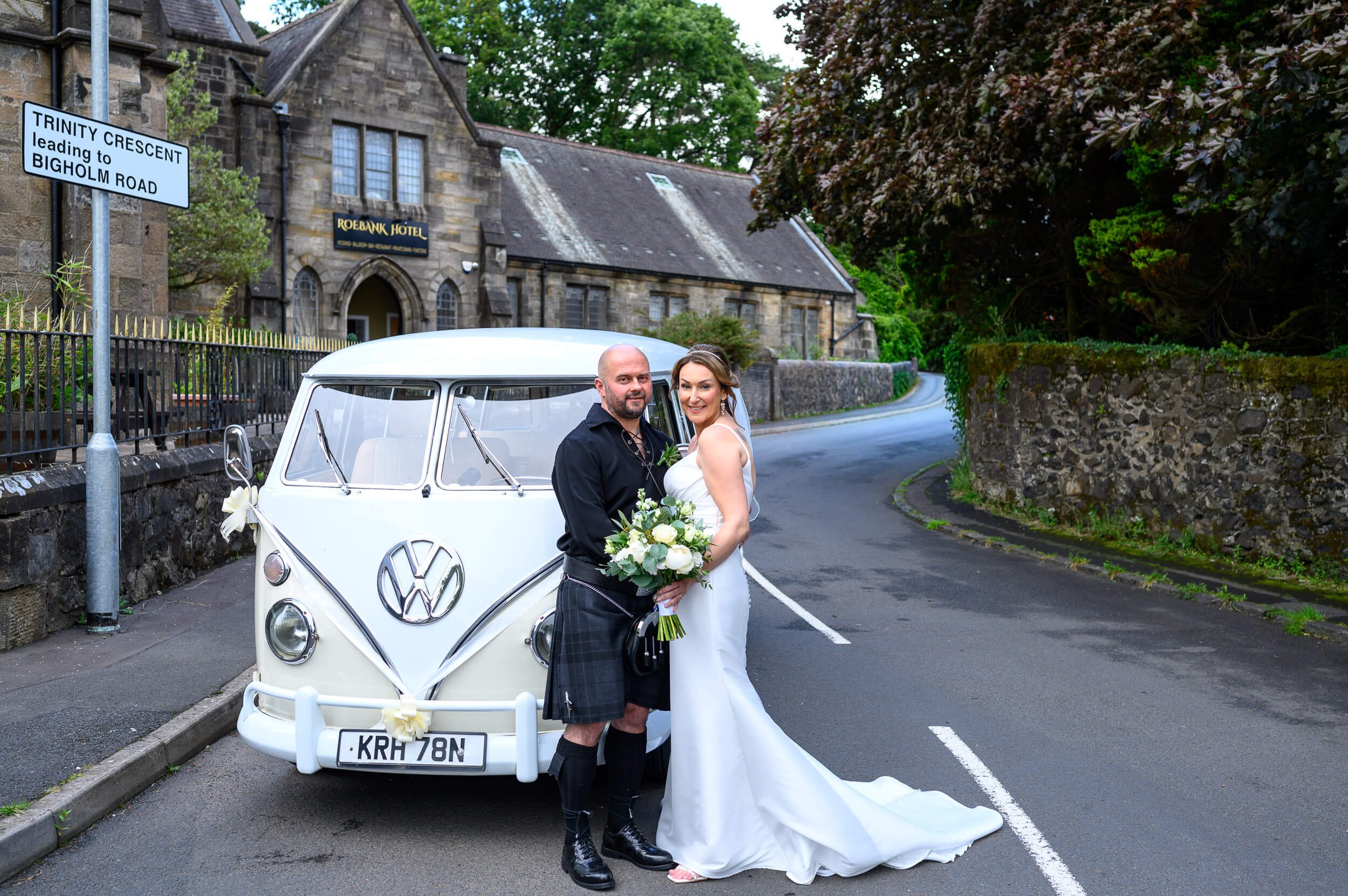 Wedding couple at Roebank Hotel in Beith with vintage camper van, captured by Ayrshire wedding photographer Thomas McCabe.