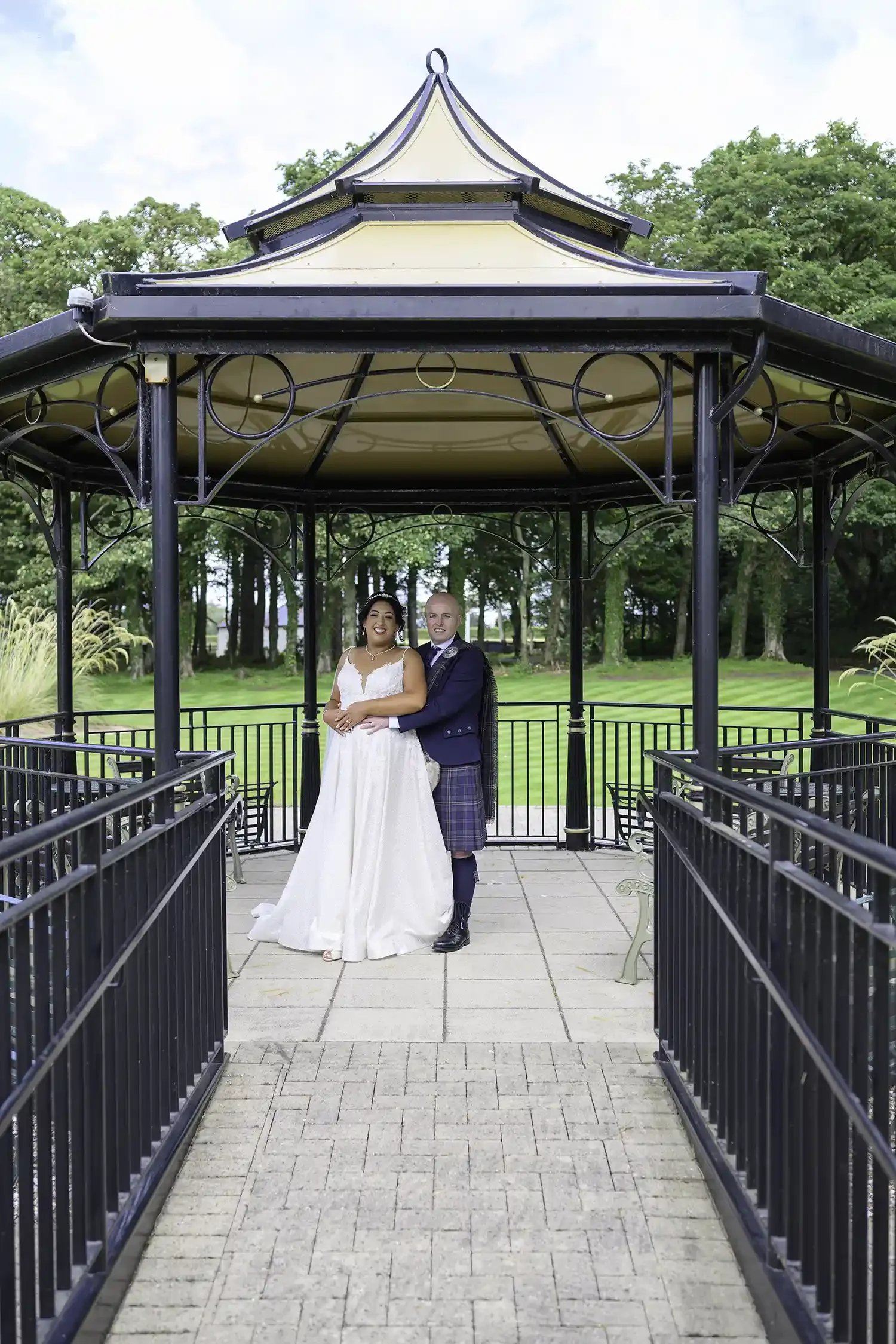Bride and groom portrait at the gazebo in the gardens of Lochgreen House Hotel in Troon Ayrshire