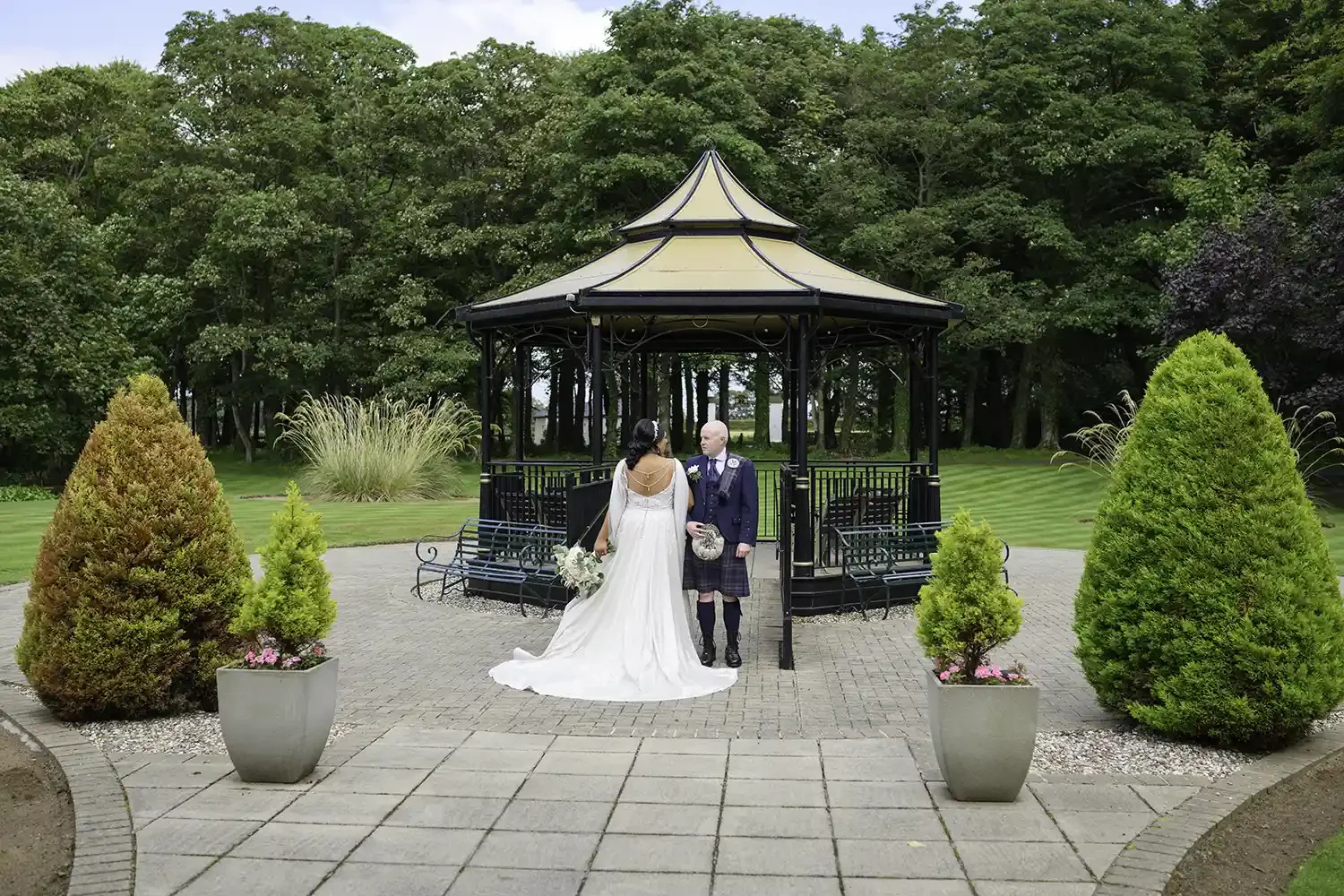 Bride and groom at gazebo during Lochgreen House Hotel wedding in Troon