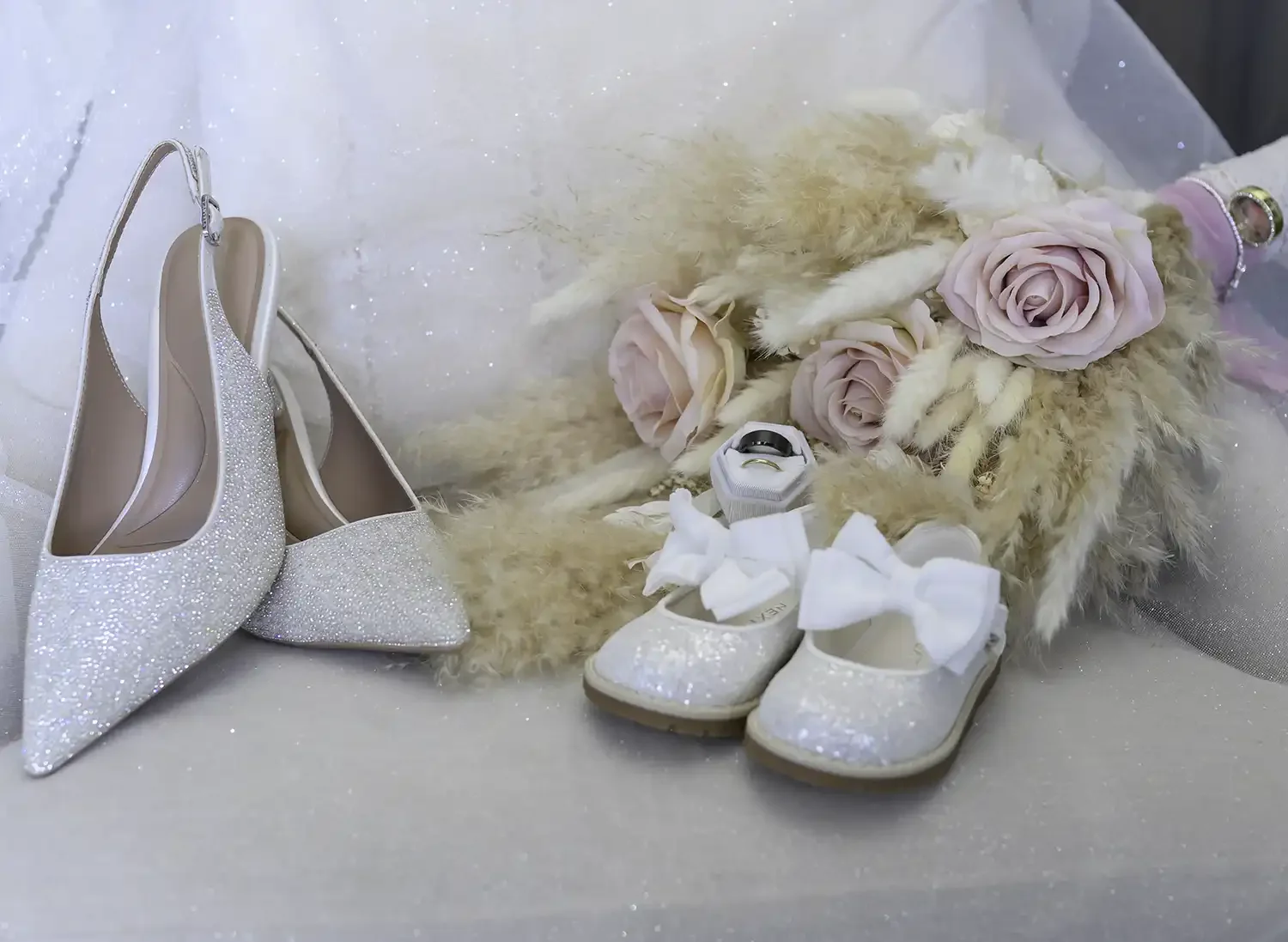 Bridal details with shoes, bouquet and baby shoes at Brisbane House Hotel in Largs