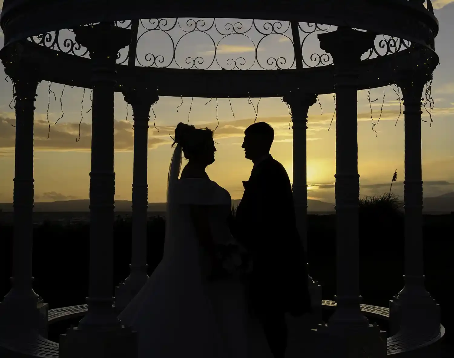 Silhouette of bride and groom at sunset at The Waterside Hotel & Spa in West Kilbride