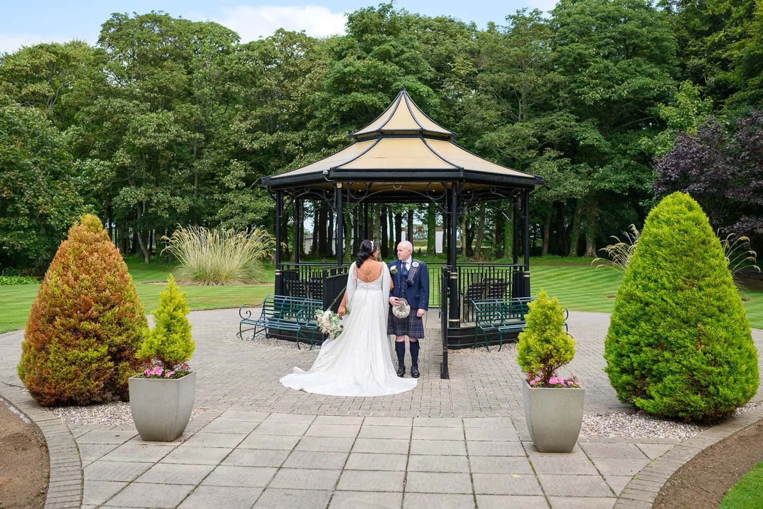 Bride and groom at gazebo during Lochgreen House Hotel wedding in Troon