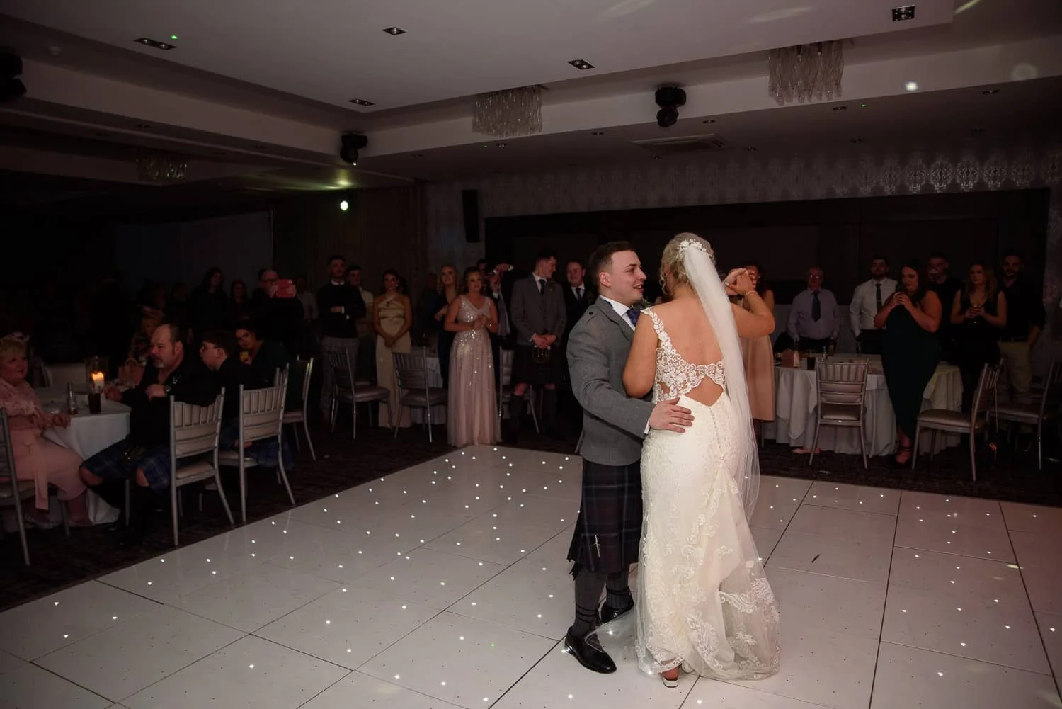 Bride and groom sharing their first dance at The Carlton Hotel Prestwick wedding reception