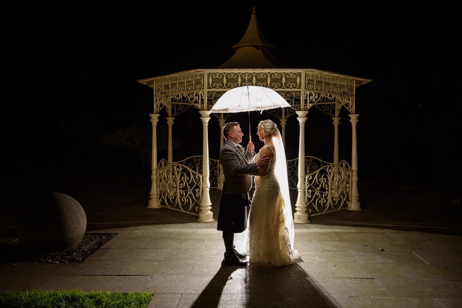 Romantic night wedding portrait under the gazebo at The Carlton Hotel Prestwick