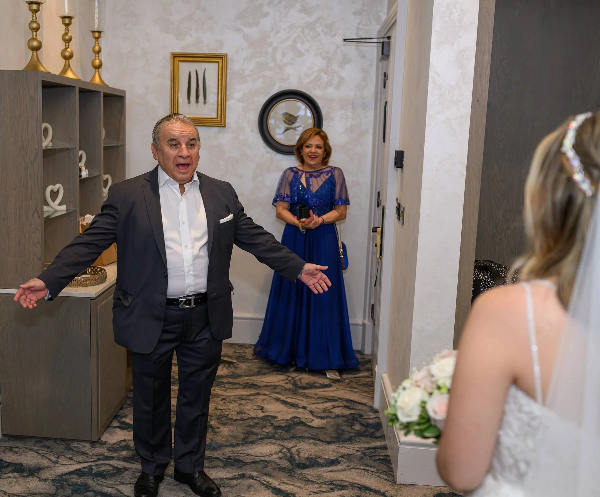 Father reacting as he sees his daughter in her wedding dress during a first look at Brig o’ Doon House Hotel in Alloway, Ayr