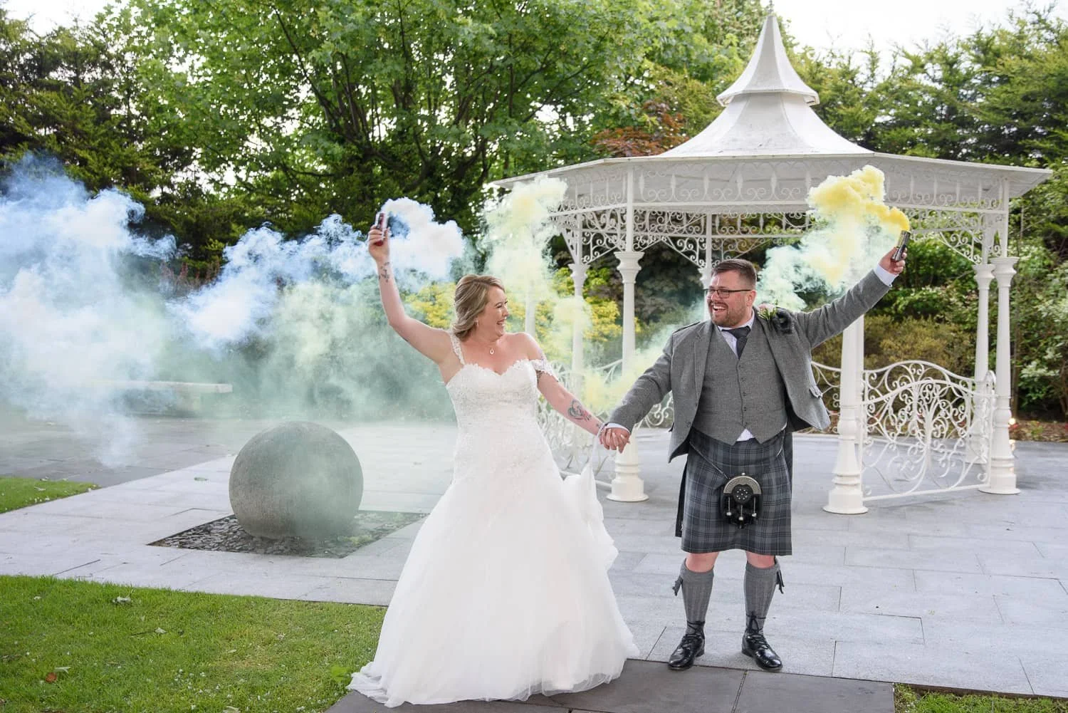 Bride and groom with colourful smoke bombs at The Carlton Hotel Prestwick wedding