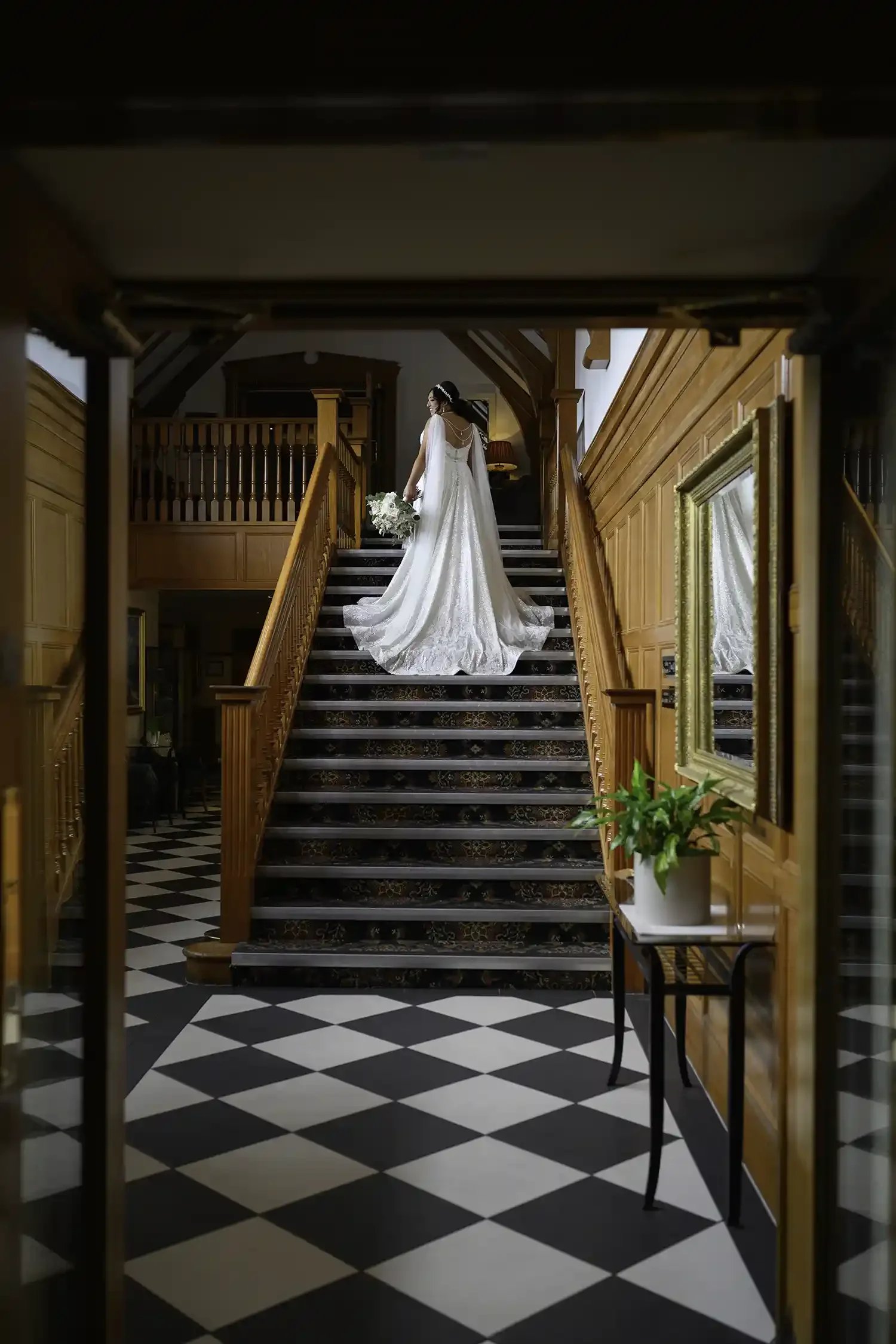 Bride walking up the staircase inside Lochgreen House Hotel wedding venue in Troon Ayrshire