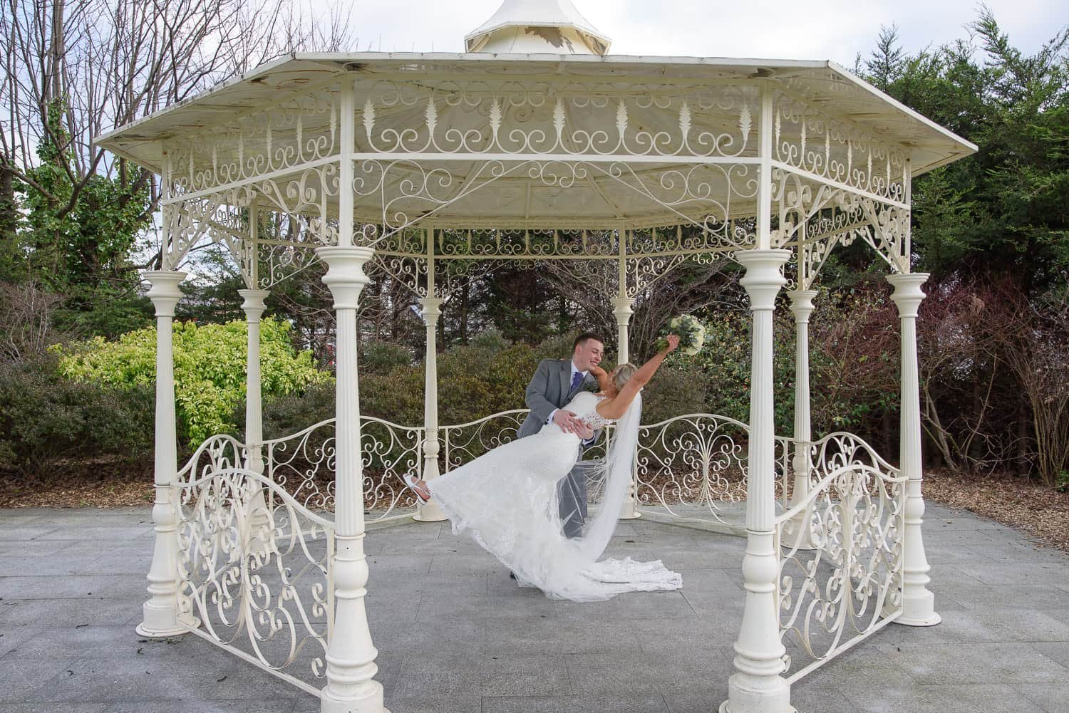 Bride dipped by groom under the gazebo at The Carlton Hotel Prestwick wedding