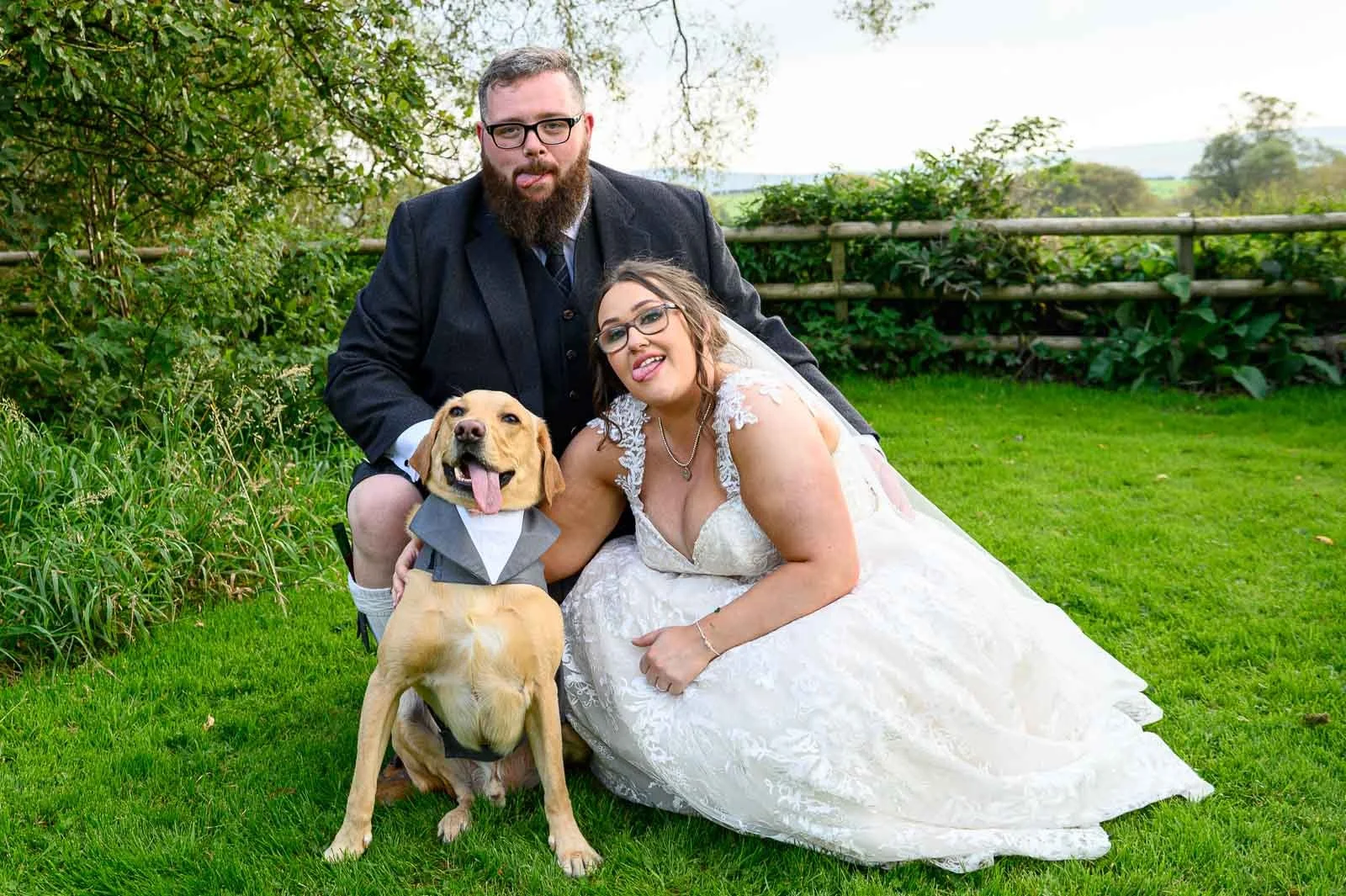 Natural and relaxed wedding photography featuring a bride, groom, and their dog at an Ayrshire wedding venue.