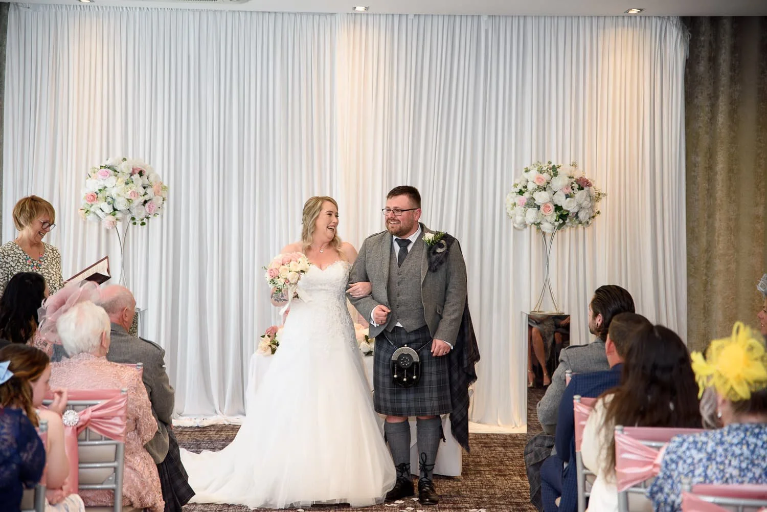 Bride and groom during their wedding ceremony at The Carlton Hotel Prestwick