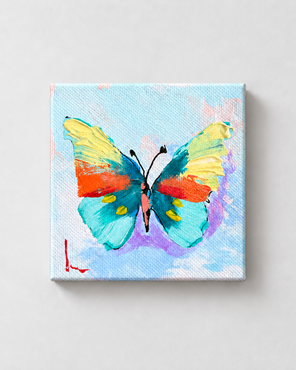 Teal+butterfly+on+a+gray+wall.png