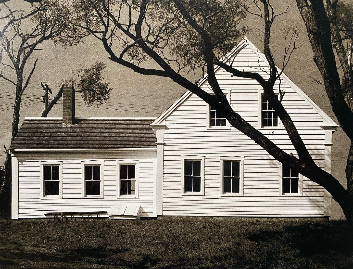 What can you say. A perfect photo of a perfect house. Titled: White House, Cqpe Cod&rdquo; by Wright Morris from 1939. We&rsquo;re especially curious about the silhouette of the tree limbs. Morris clearly framed the shot so the meandering branches ov