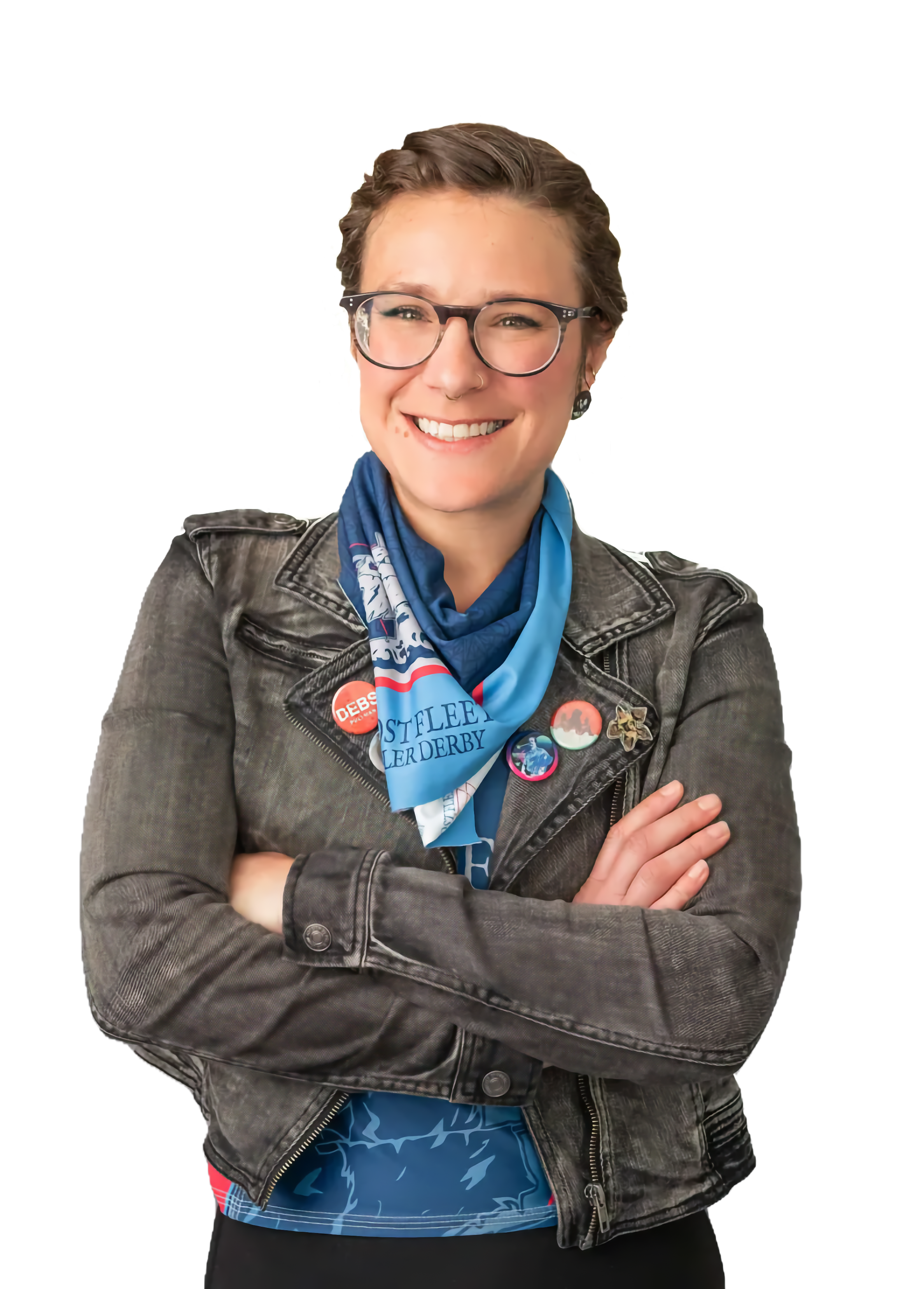 Skater, Booz, wearing a blue Ghost Fleet Roller Derby jersey, denim jacket, and GFRD bandana around her neck.
