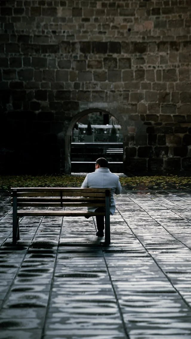 Man sitting alone on bench