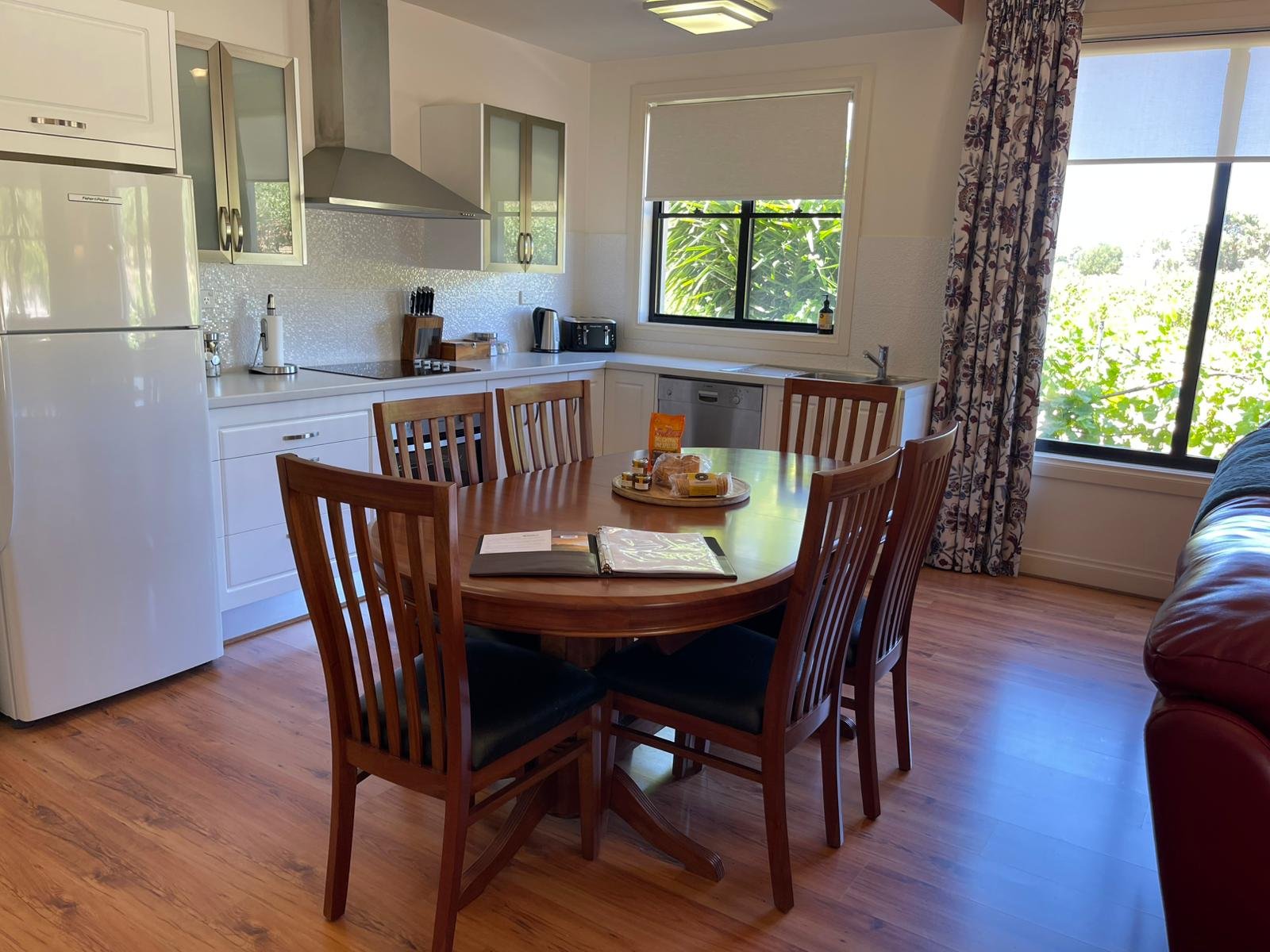 Open plan kitchen and dining area at The Loft, Barossa Shiraz Estate