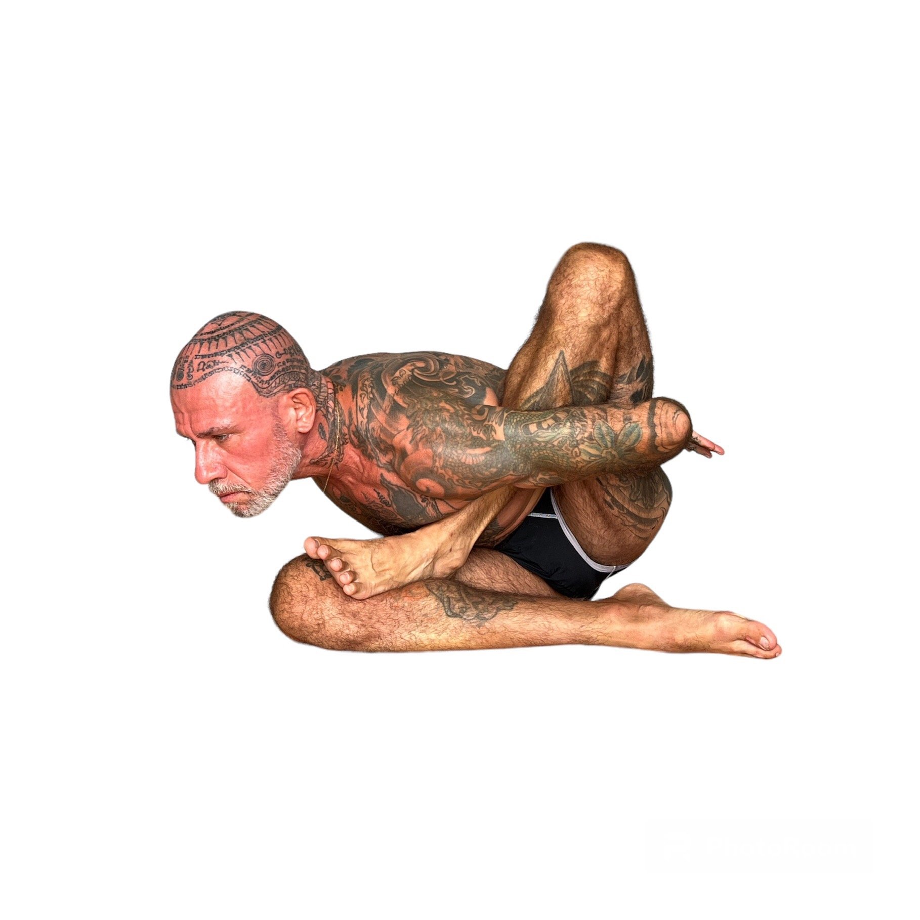 Jason Douglas Schramm of The Yoga Shala Rawai Phuket demonstrating Padangustha Sirsasana.