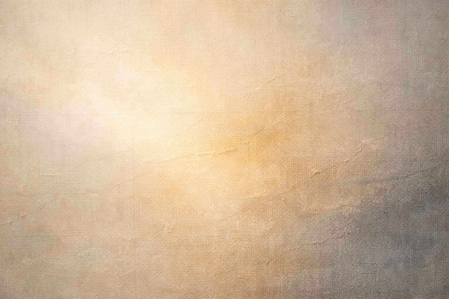 Close-up of beige textured paper or fabric with visible fibers and subtle color variations.