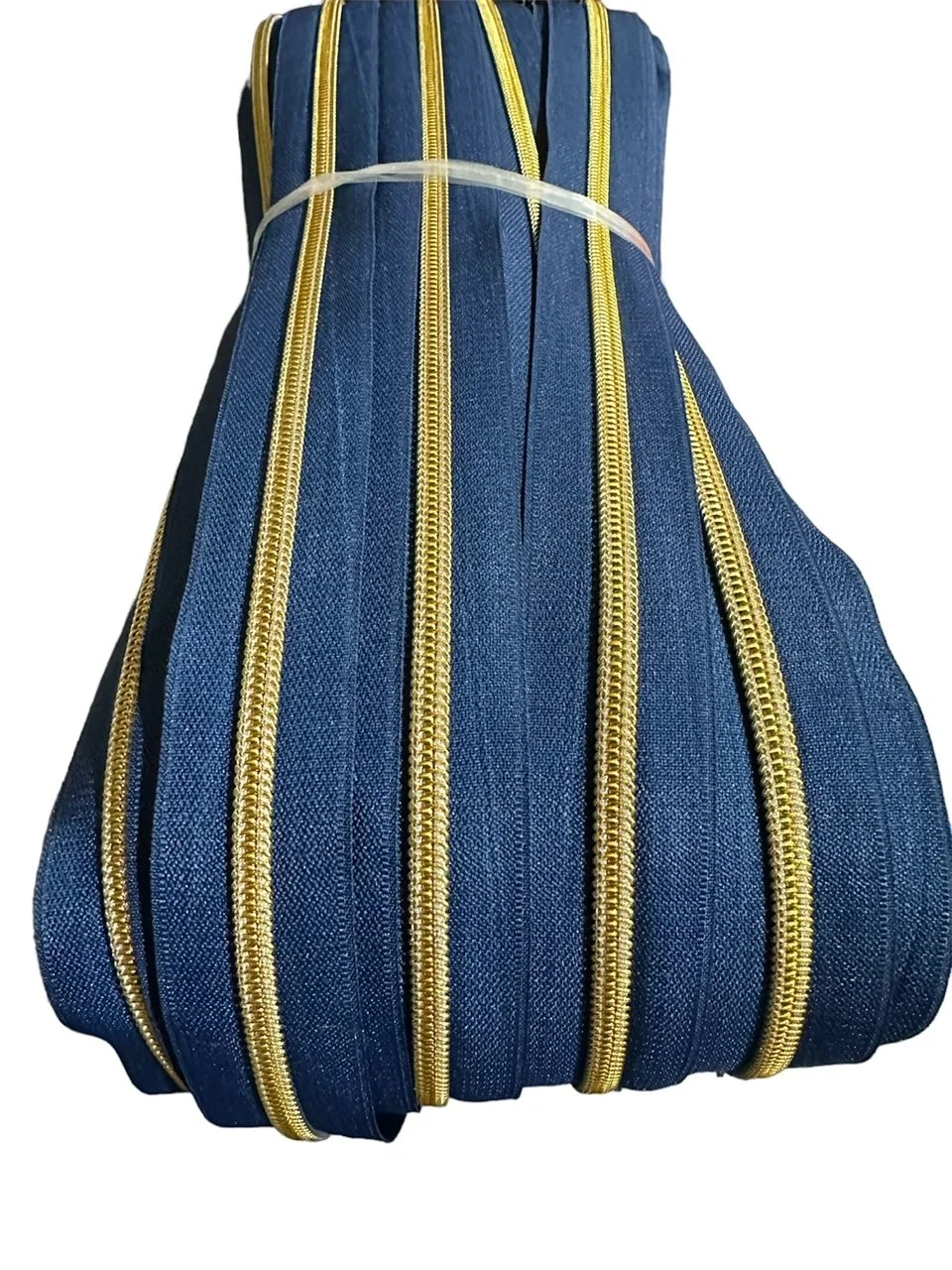 Antique Gold on Navy Zipper Tape - #5 Nylon Coil Teeth
