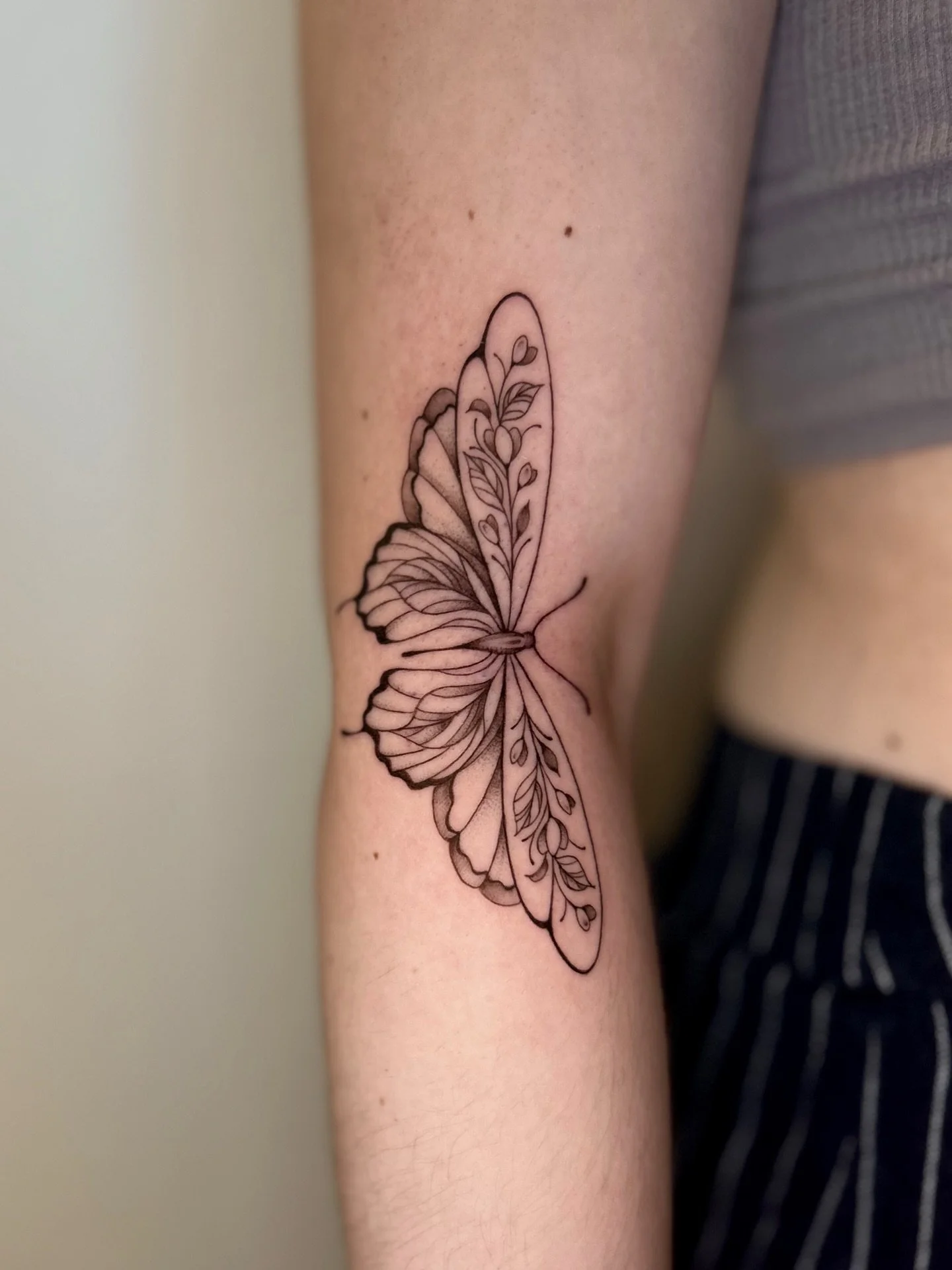 an ornate butterfly. 

in the best placement for it too. 

thanks for coming in again kaylee!