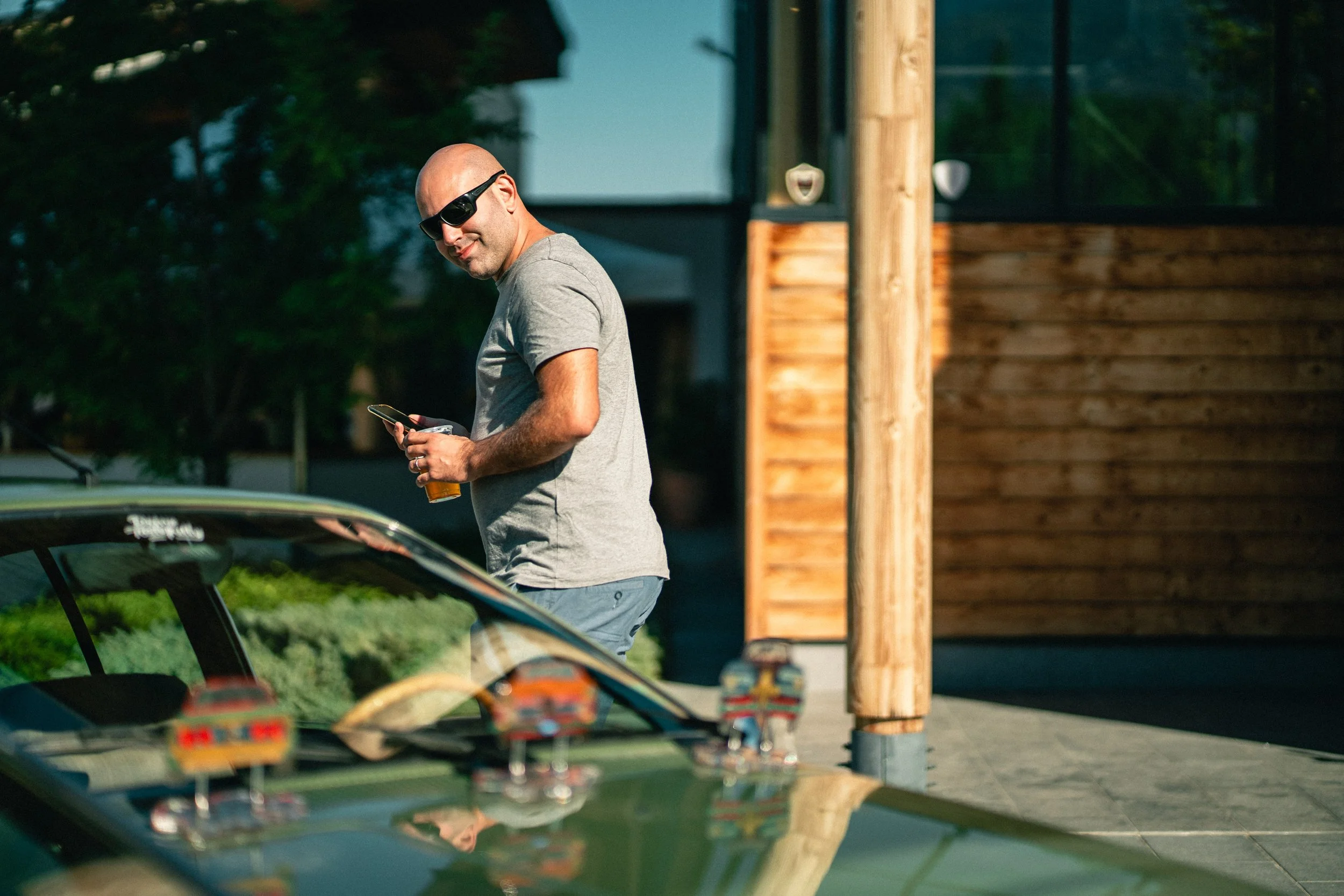 Man looking at vintage car