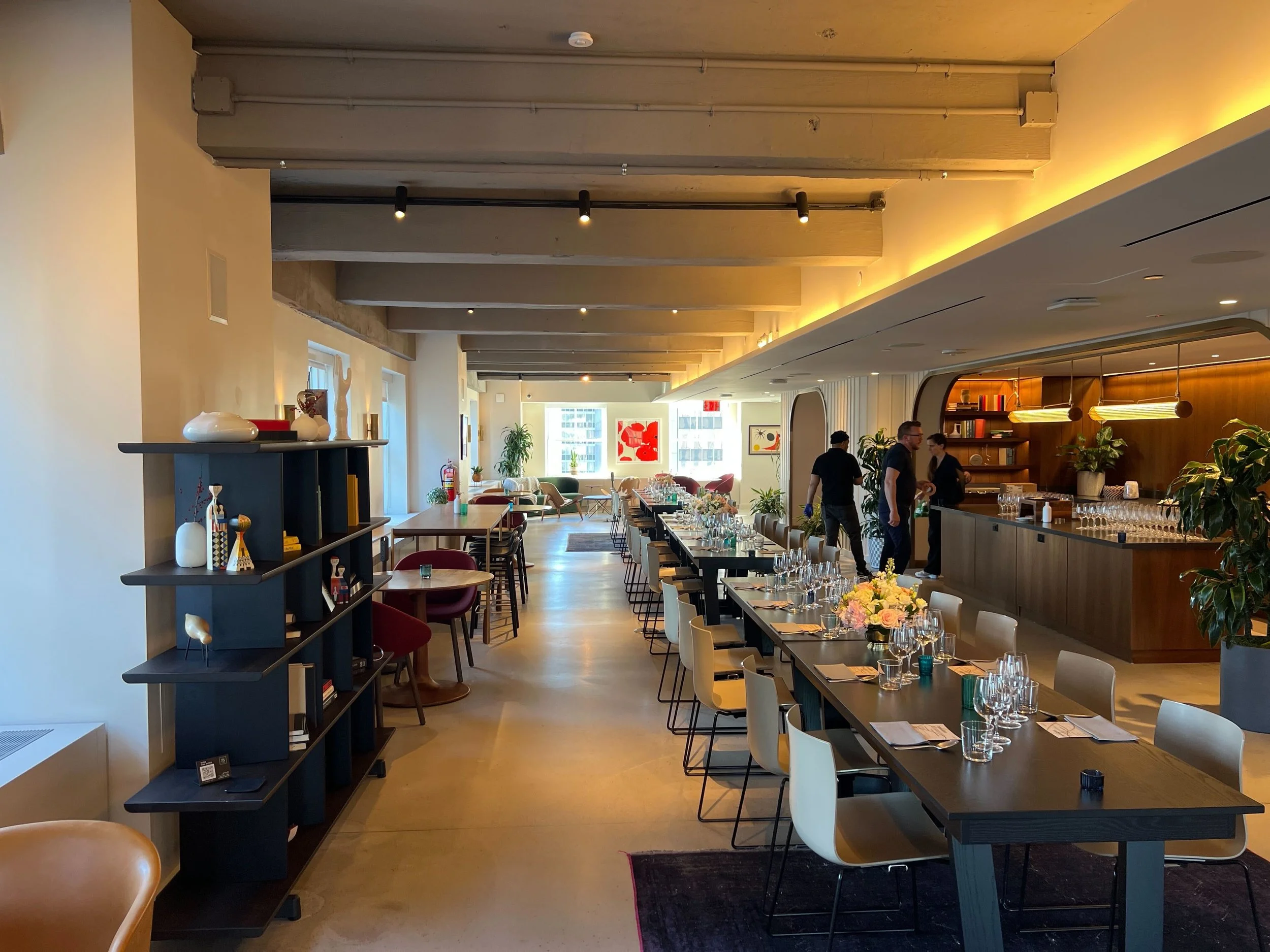 Elegant dining and lounge space at Club 75 with art deco-inspired interiors, warm lighting and views of the Manhattan skyline.