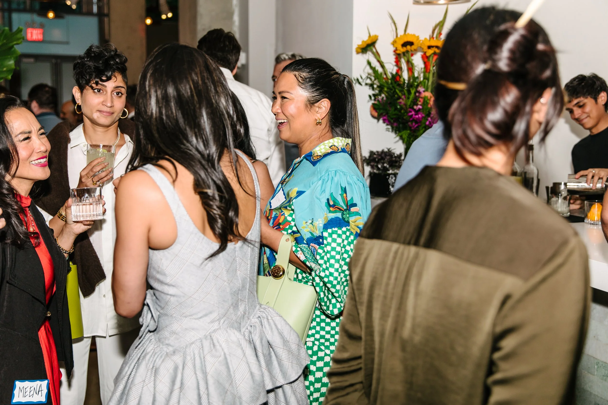 People enjoying a product launch event at Chelsea Industrial in New York City 