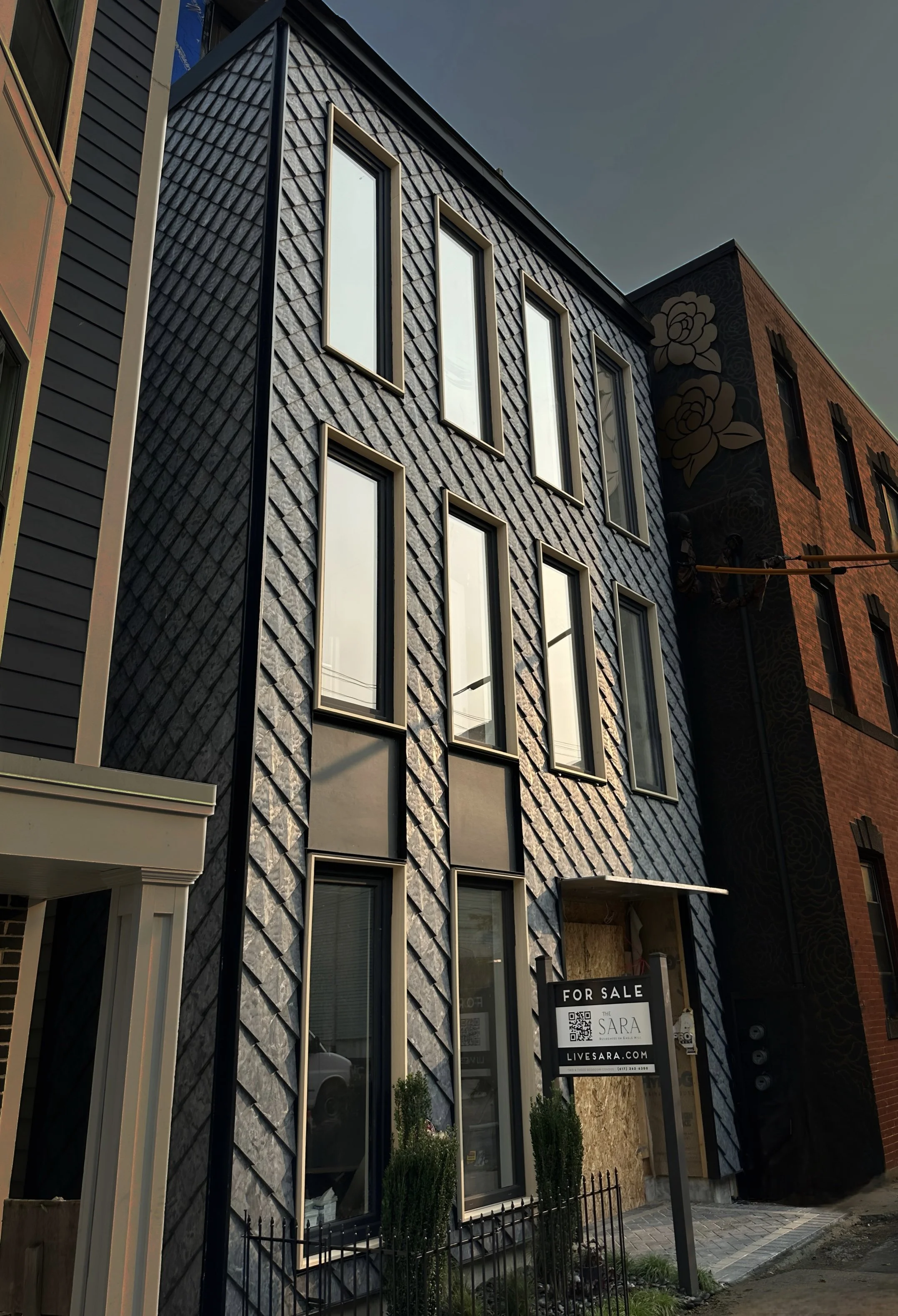 Upper half of facade from The Sara in Boston, clad with recycled tiles from Pretty Plastic