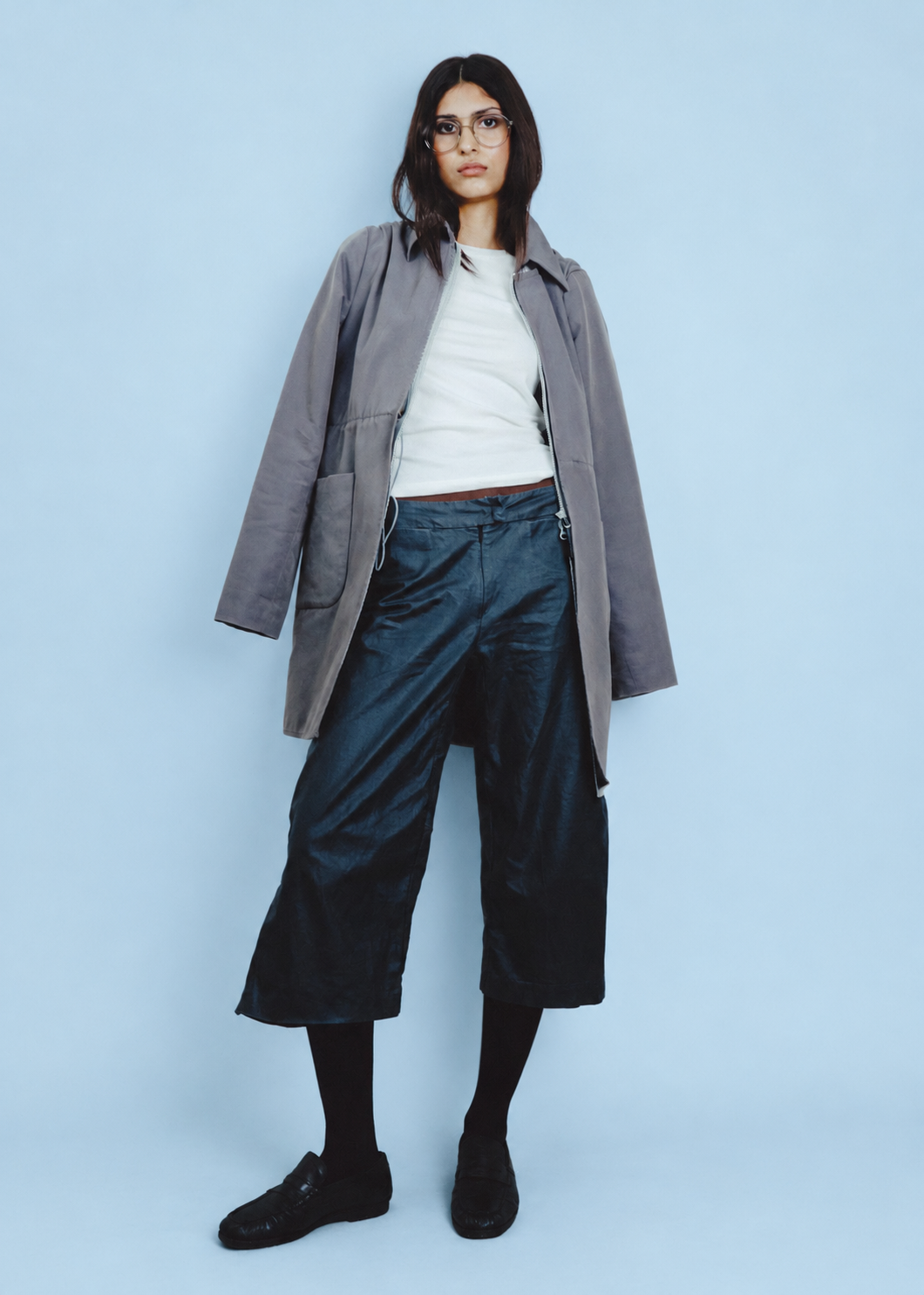 Portrait Against a Powder Blue Backdrop.png