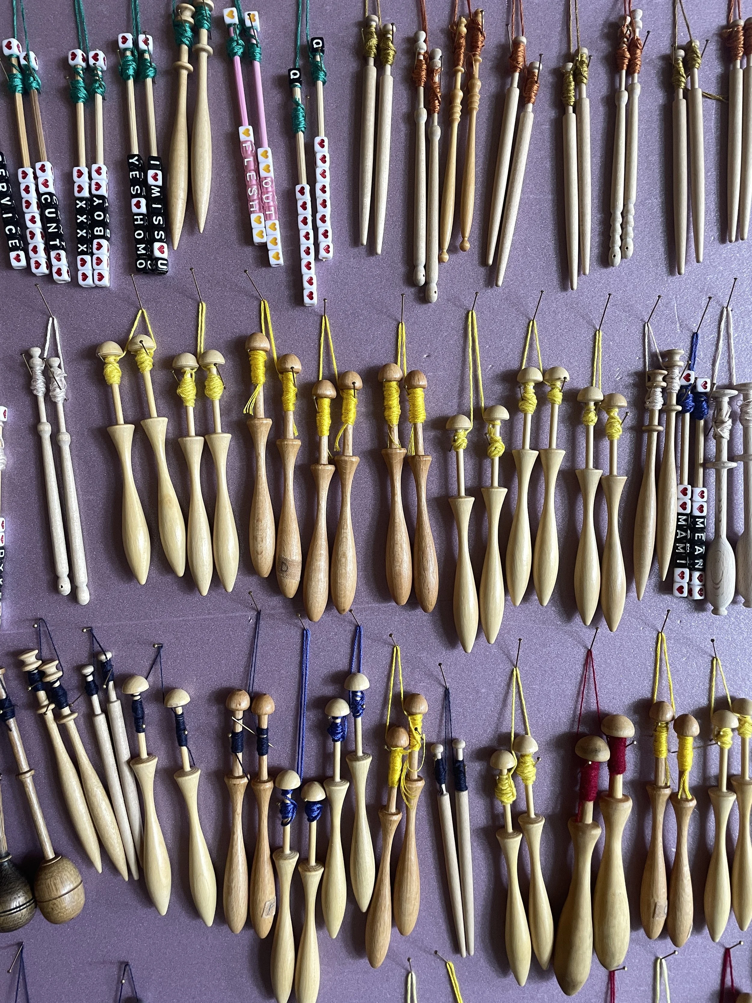 Bobbin Lace bobbins with colorful yarn for electronic textile projects, Electronic Textile Camp (ETC) co-organized by Craftwork