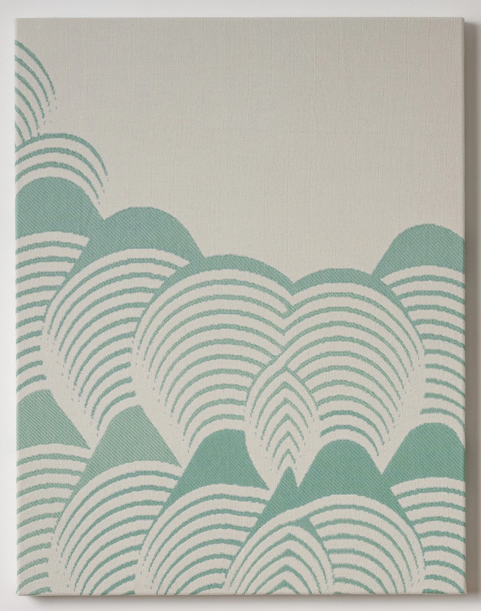 Woven textile in sea green and off-white showing layered, overlapping arches that rise like waves or hills from the bottom.
