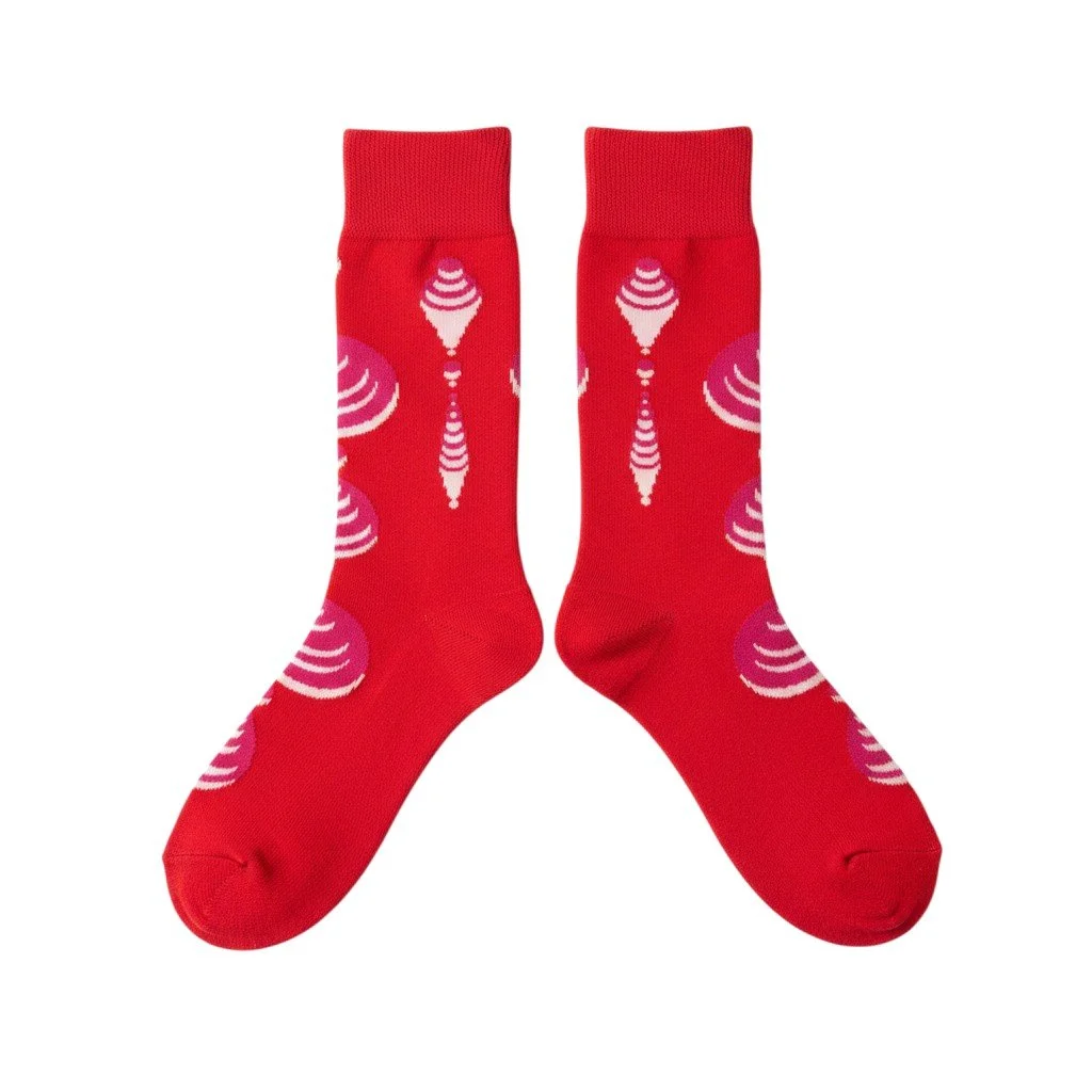 Echo Knits crew socks in red with pink concentric-circle knit pattern representing message frequency, flat lay product shot