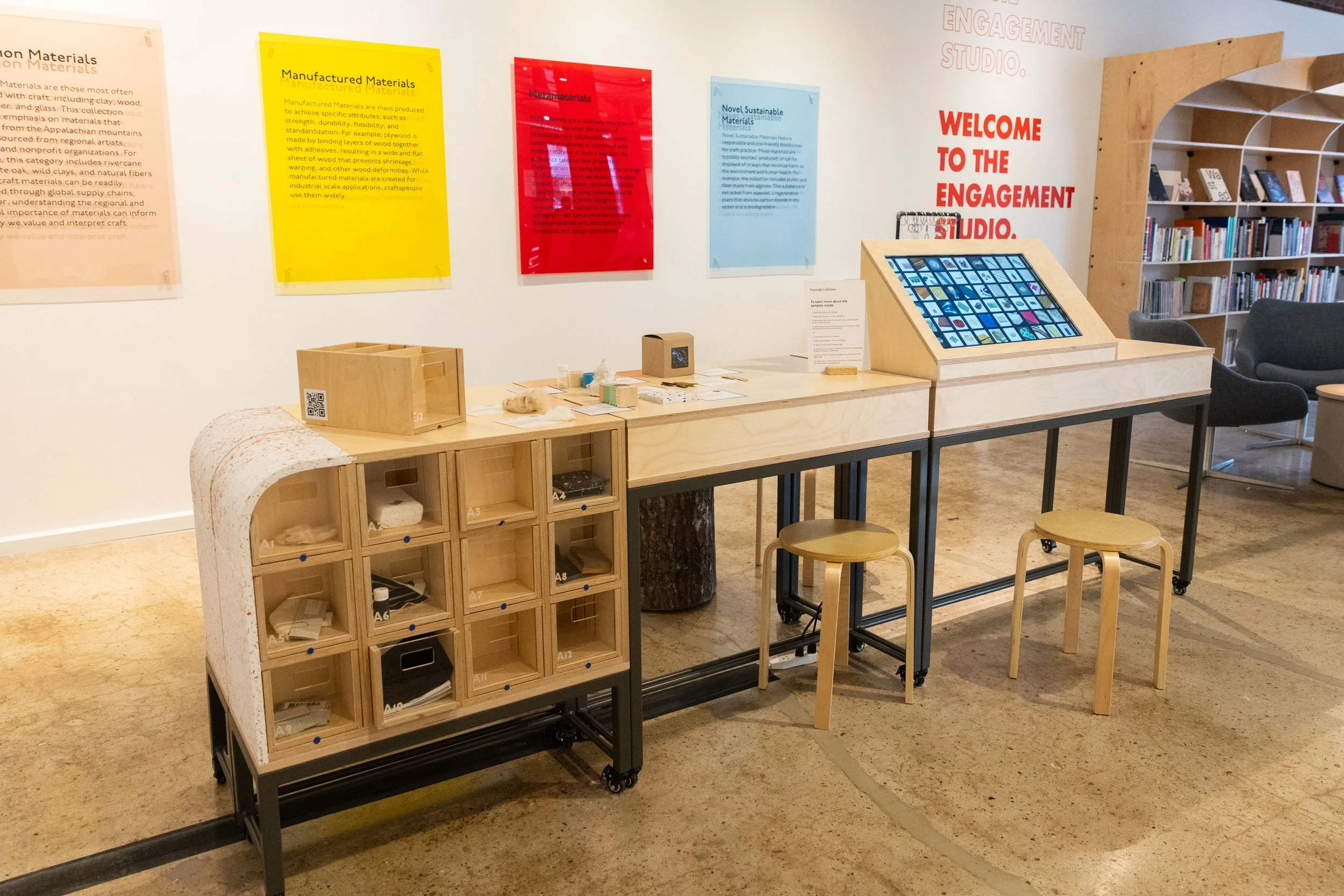 Materials Collection interactive display at Center for Craft,  featuring modular sample drawers, digital touchscreen catalog, and  material category signage designed by Craftwork