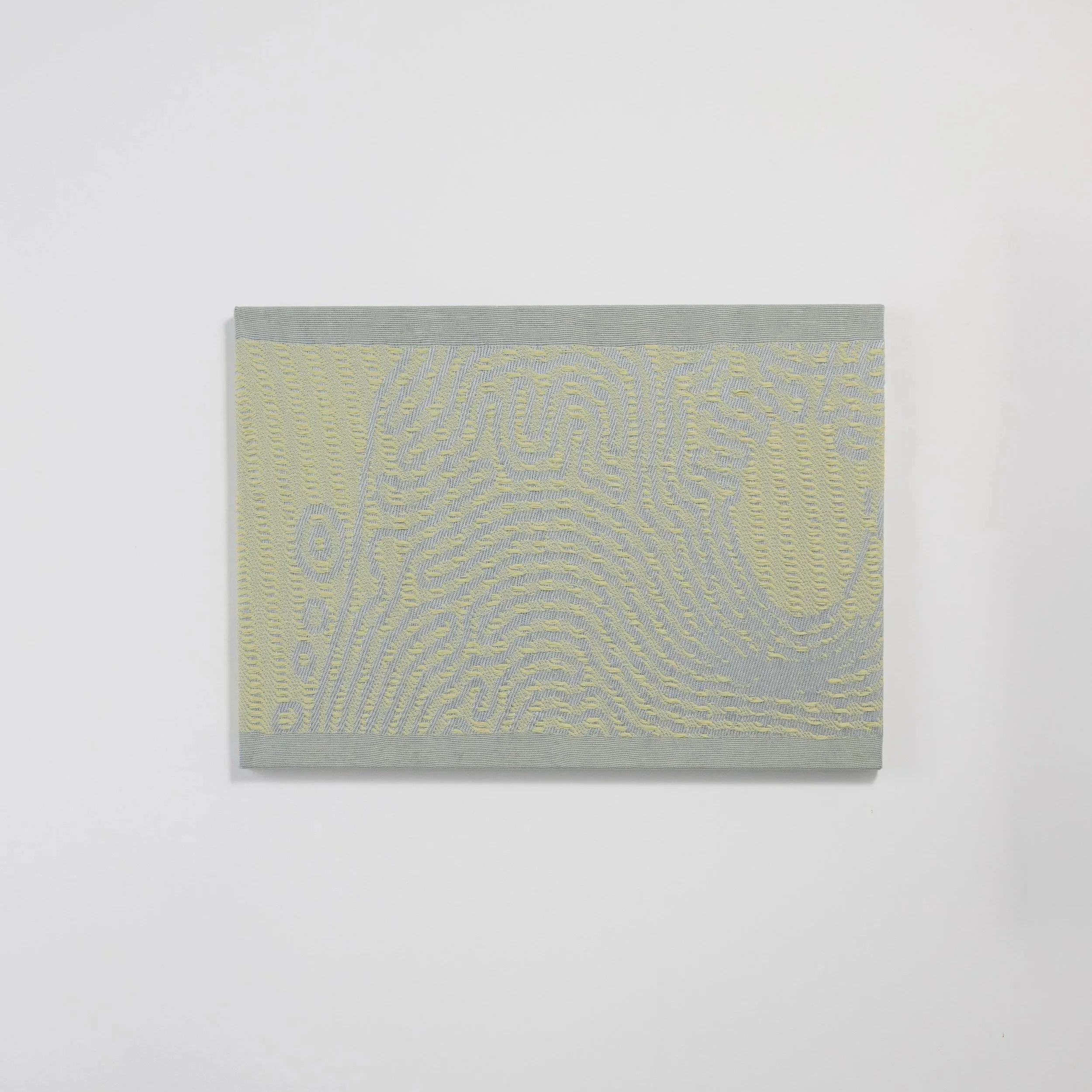 Detail of a Slow Medium woven panel in gray and yellow, showing  dimensional lichen-inspired weave structure by Craftwork