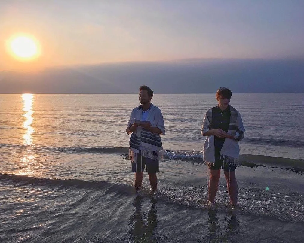 Prayer leading in the Sea of Galilee
