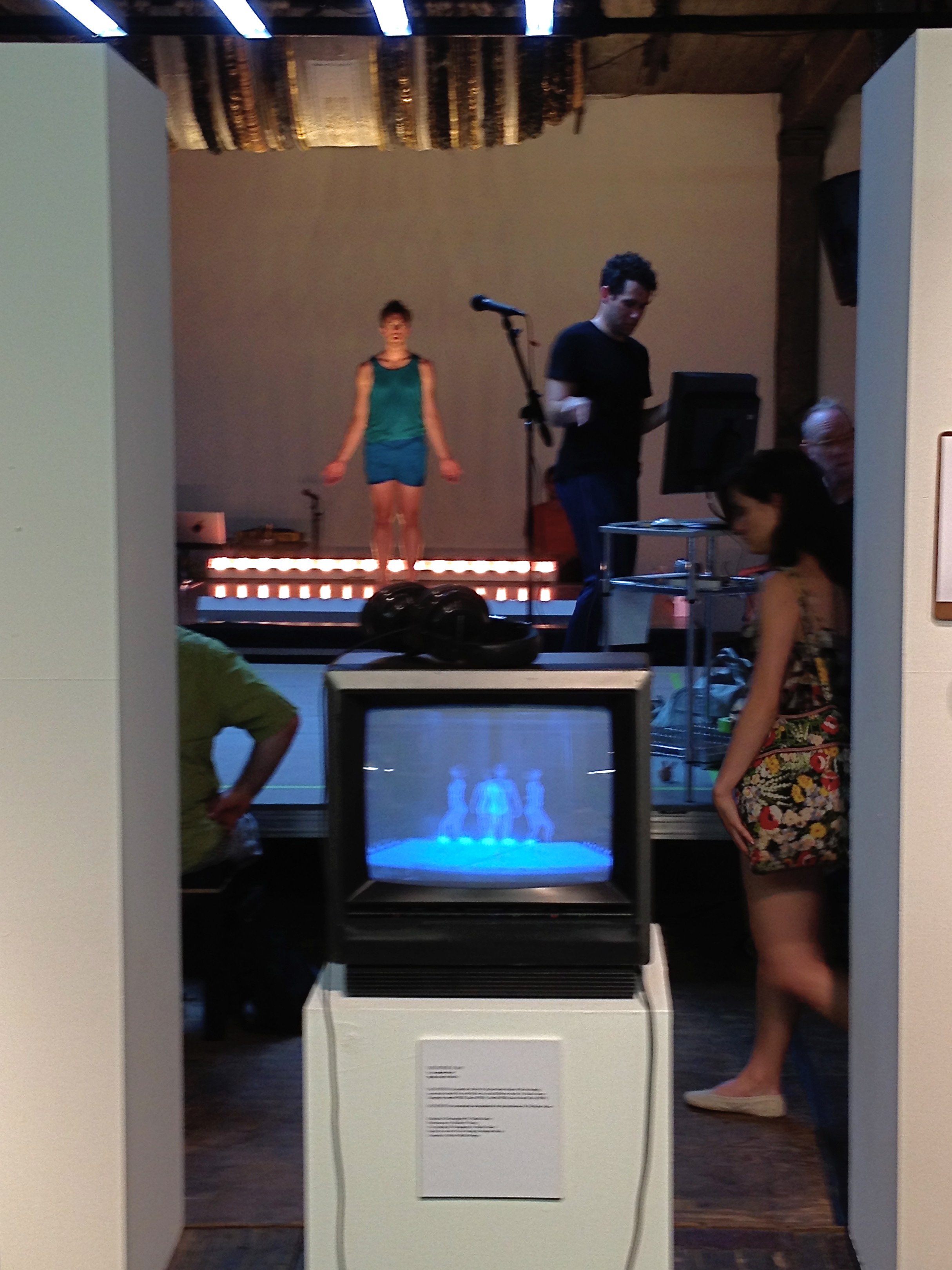 The video of Heather O playing on a small box TV on a pedestal during a performance of The People To Come at the Invisible Dog.