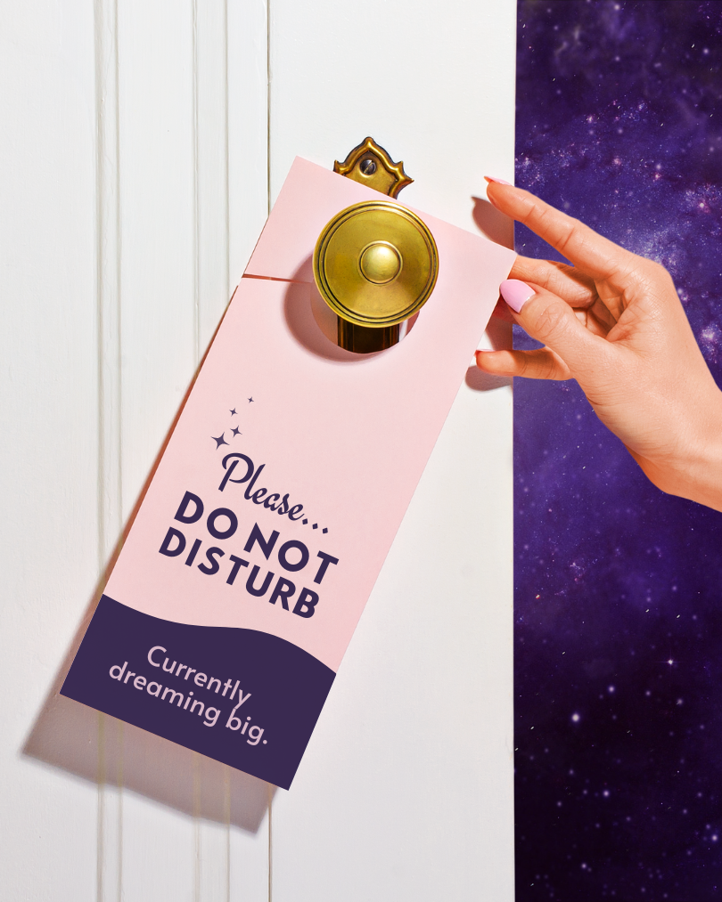 An image of a customizable Canva template by Shamblen Studios that says "please do not disturb... currently dreaming big."