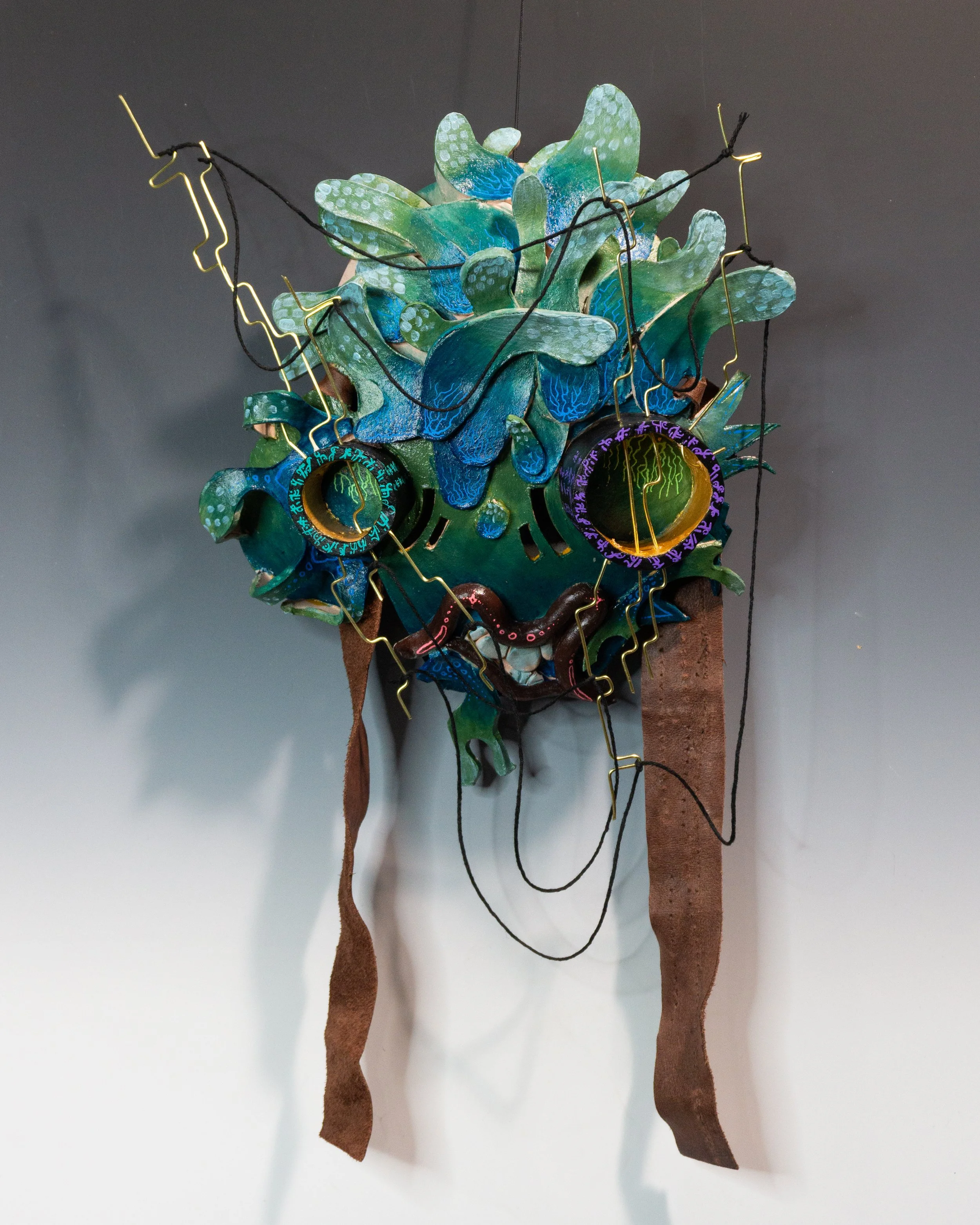 "Only seeing the tangle of wires" 
17x10x3 ceramic and mixed media