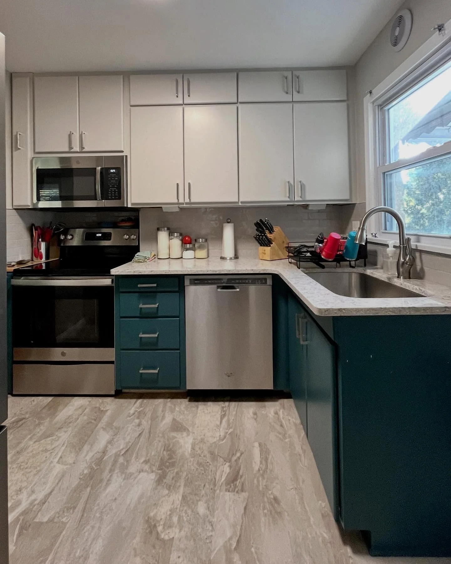 I can&rsquo;t take credit for the decor in these photos, but I can tell you that this kitchen makeover was the result of so much careful consideration of the homeowners&rsquo; need for function and storage. The small room had significant challenges a