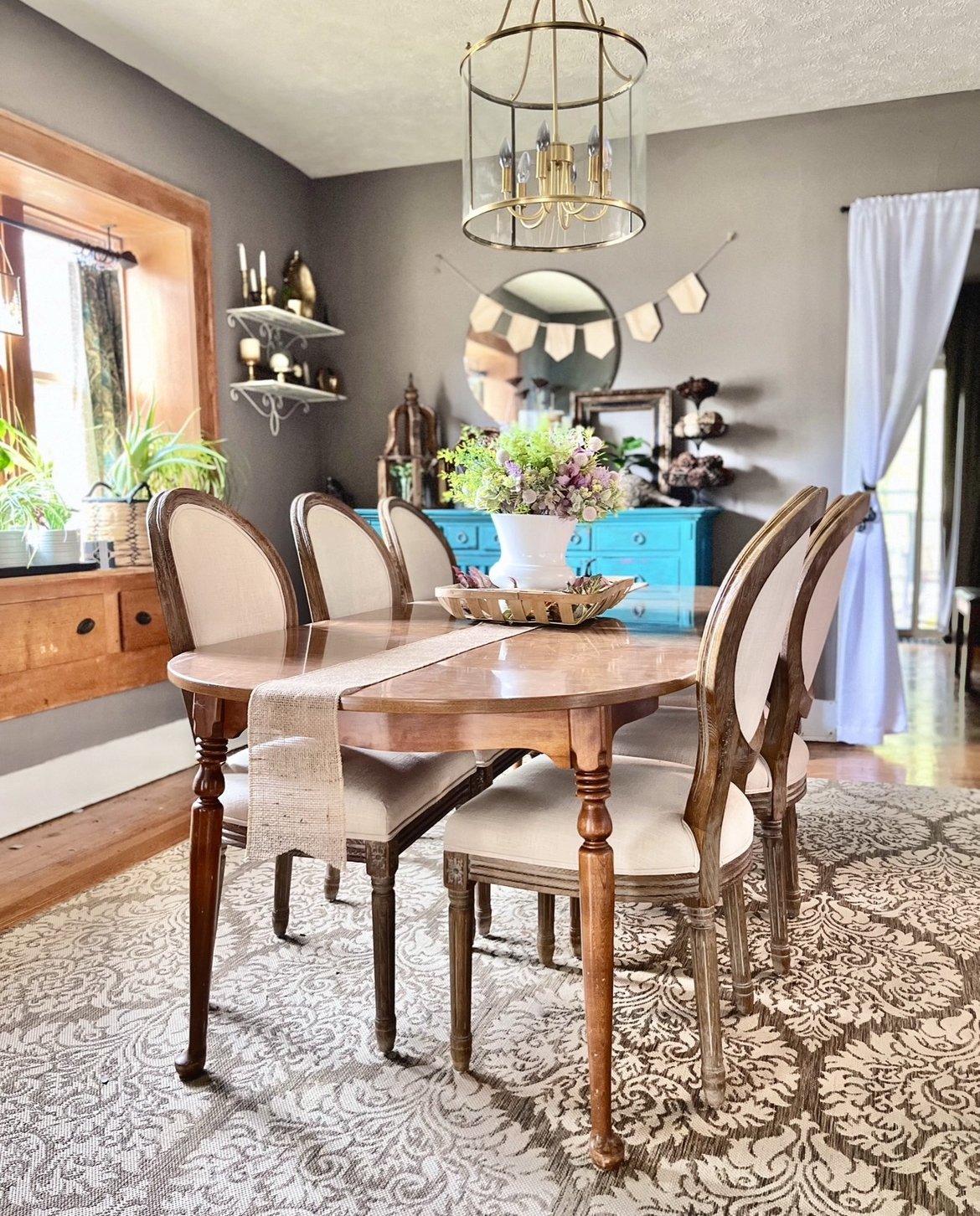 Dining Room makeover included:
Fresh paint, new dining furniture, custom decor, new light fixture, custom draperies.