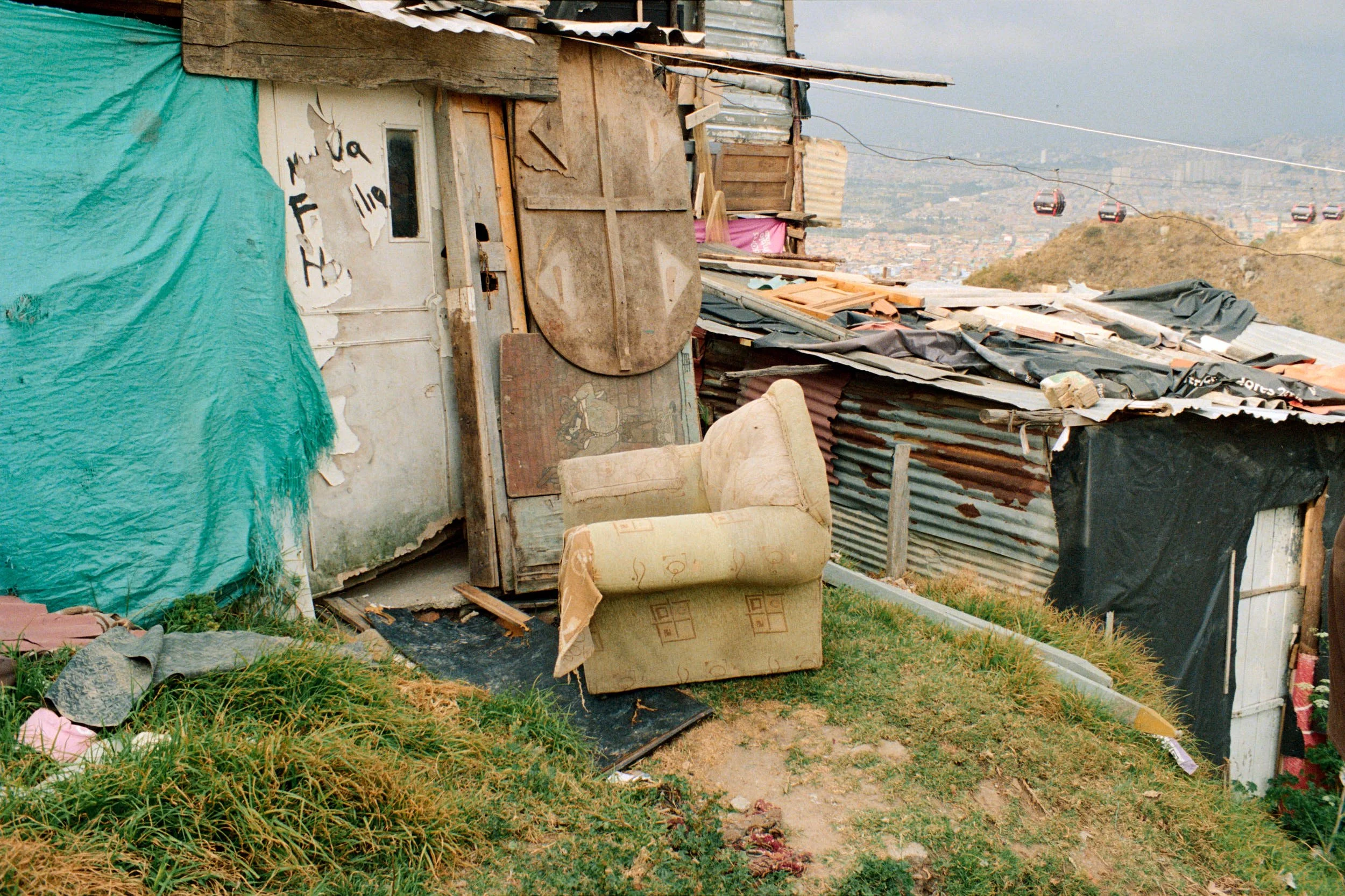 Two neighbors houses, almost touching, showing the variety of material used. 