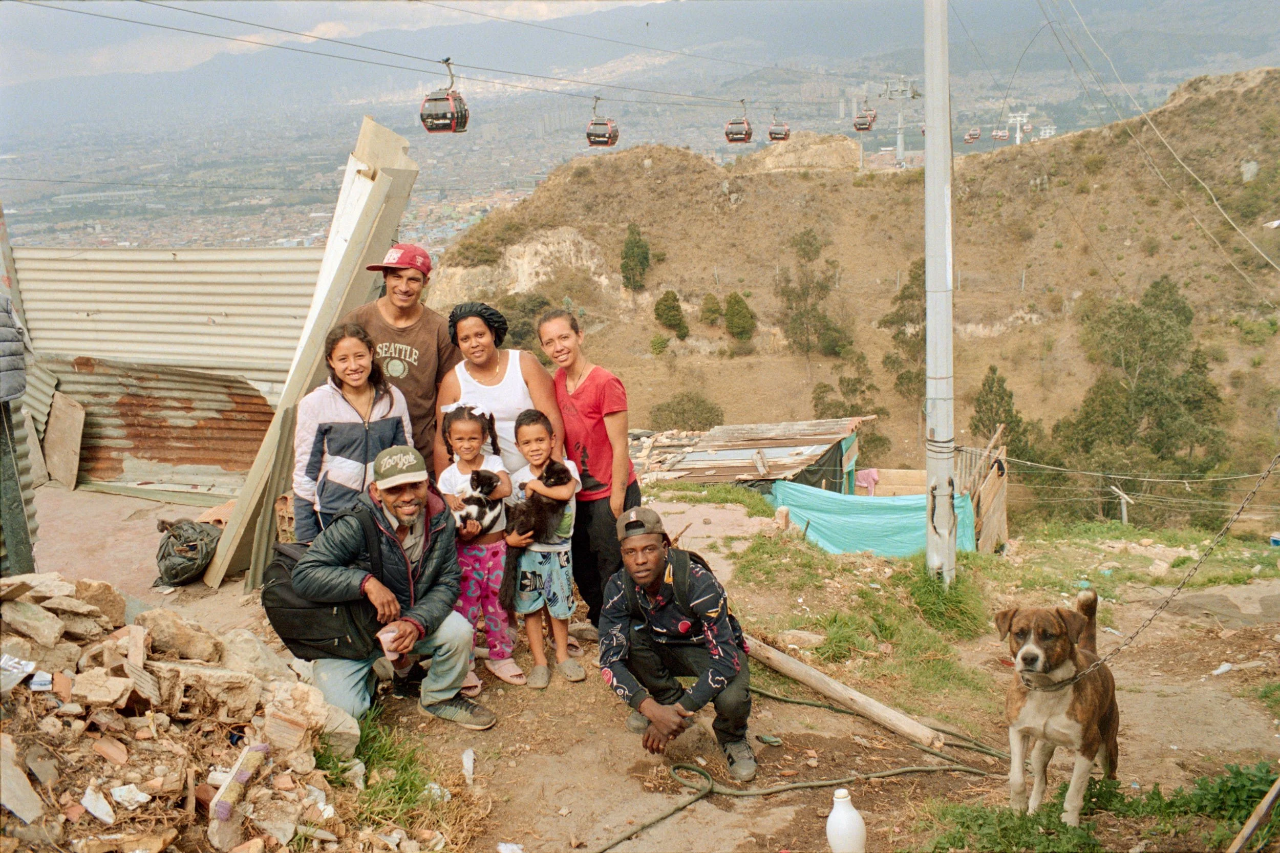 Group portrait of neighbors from four adjacent houses. 