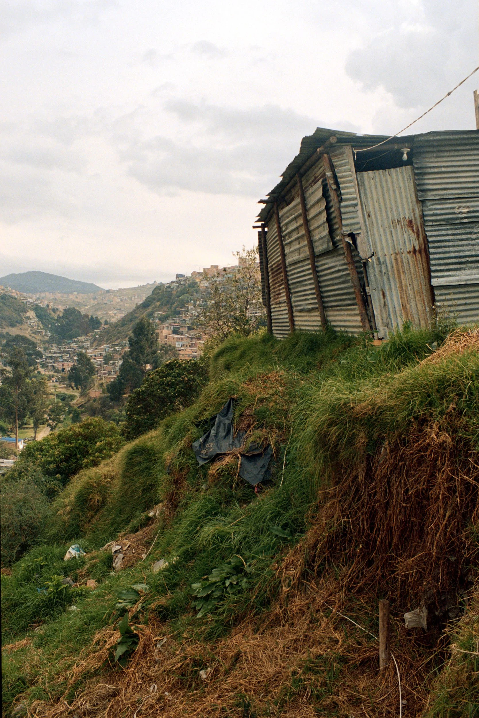 A house at the very top of a steep ravine.  