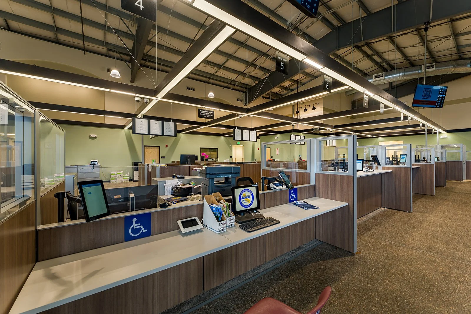 Accessible service counter in DMV public lobby. 