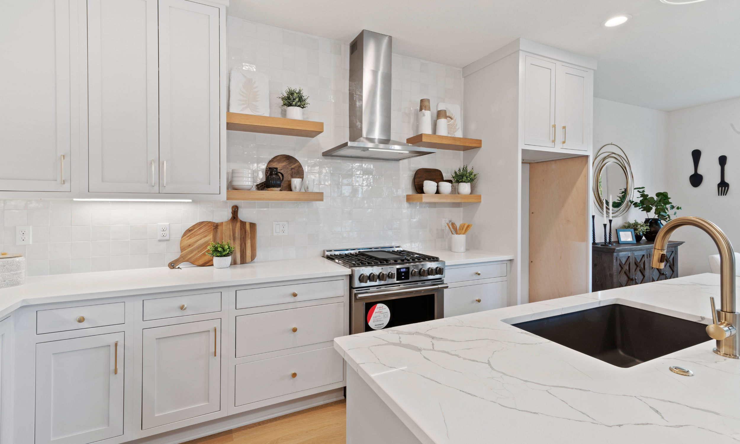 Bright white kitchen with open shelving