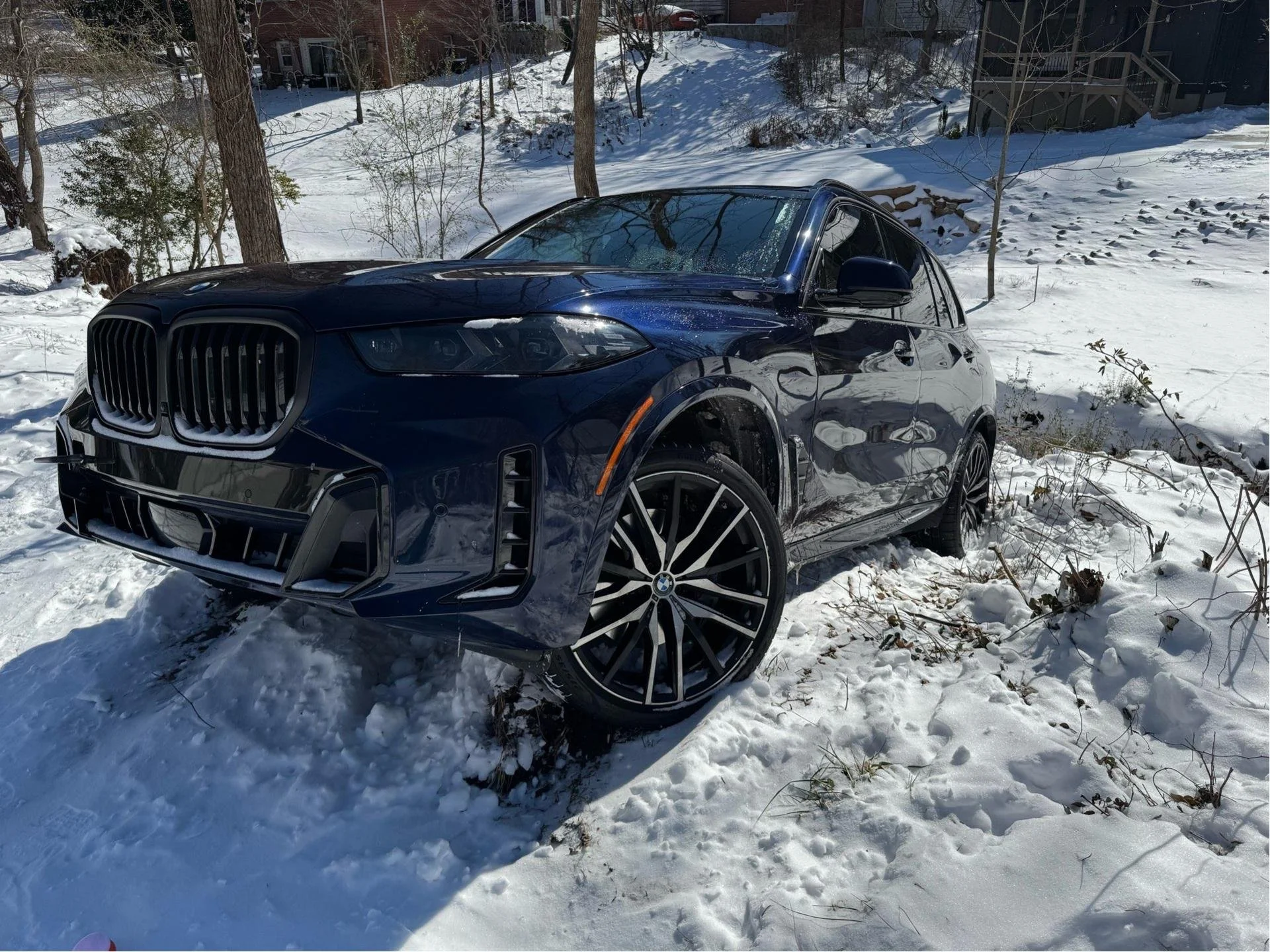 alt="SUV stuck in deep snow on a winter road."