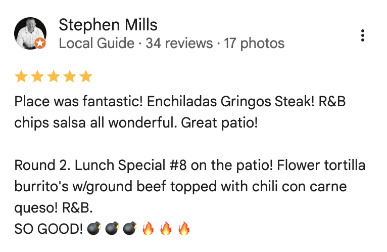 Screenshot of a review by Stephen Mills, a local guide, praising a restaurant for their enchiladas, steak, chips, salsa, and patio seating, mentioning a specific lunch special with ground beef and chili con carne, and five fire emojis indicating excellent food.