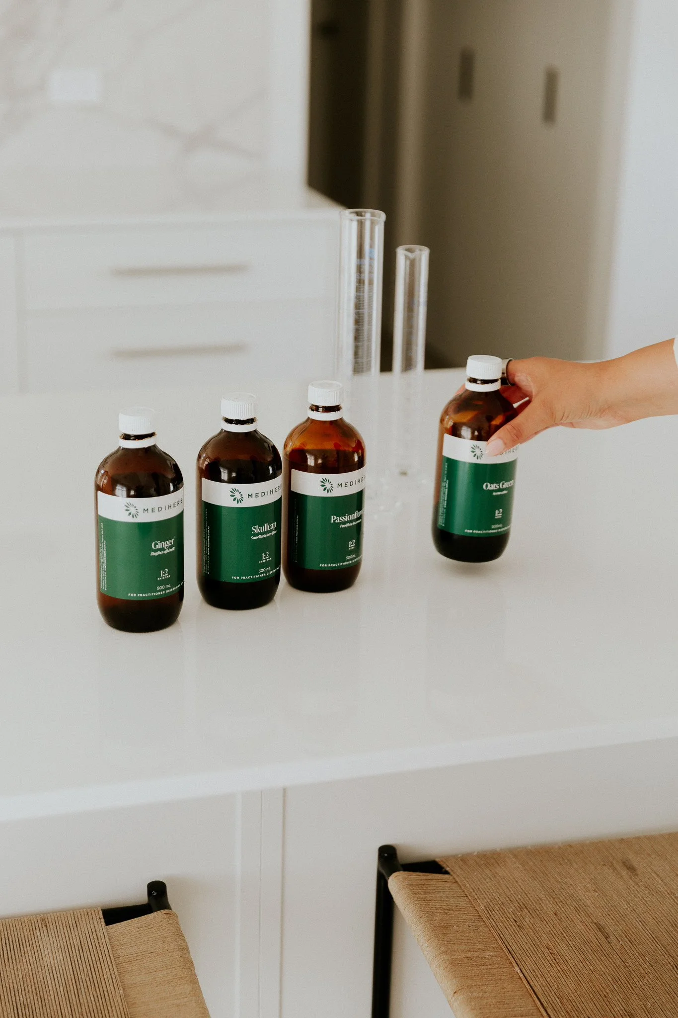 Medi herb bottles lined up on a table