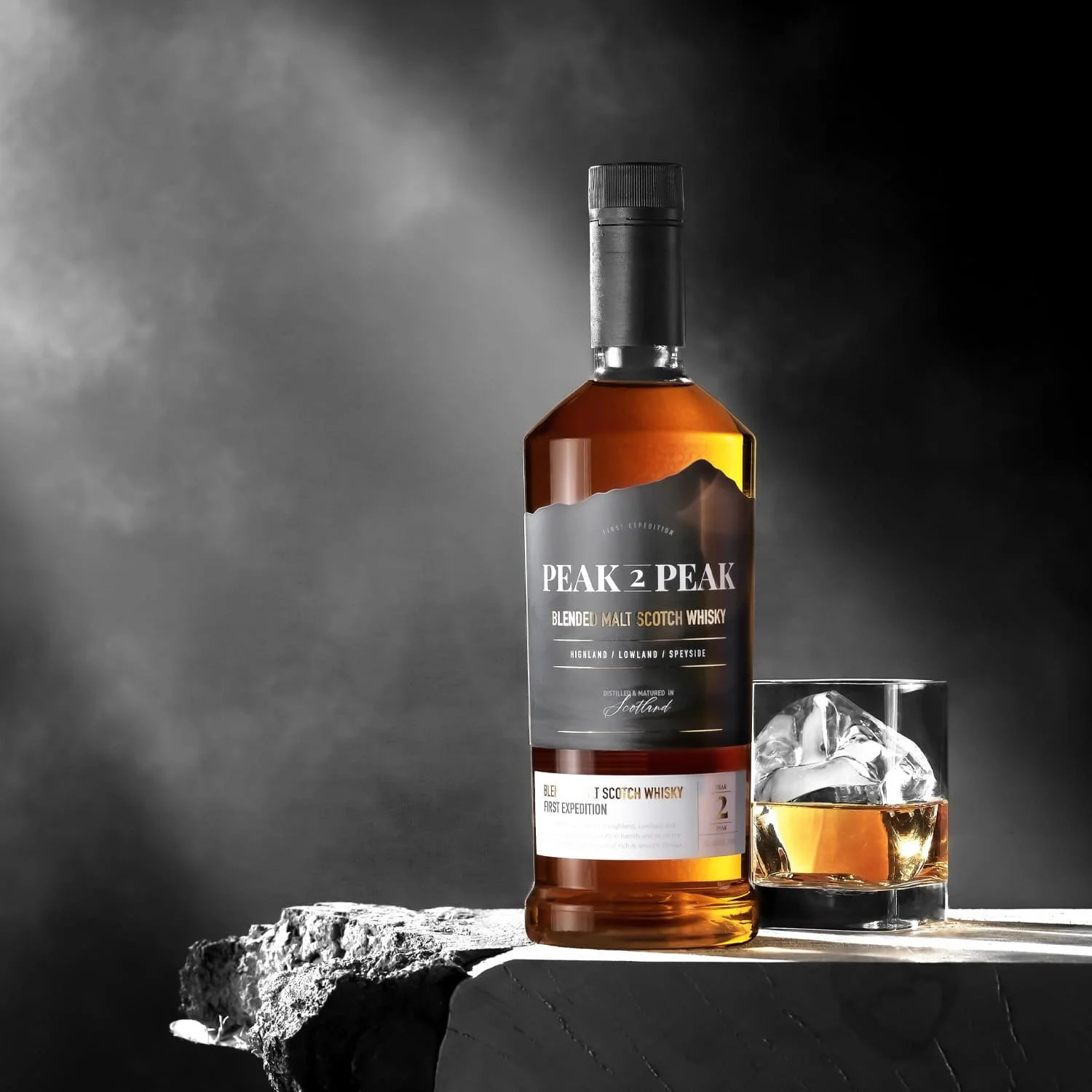 Peak 2 Peak blended malt Scotch whisky with glass, rich flavour of honey, spice and oak cask character