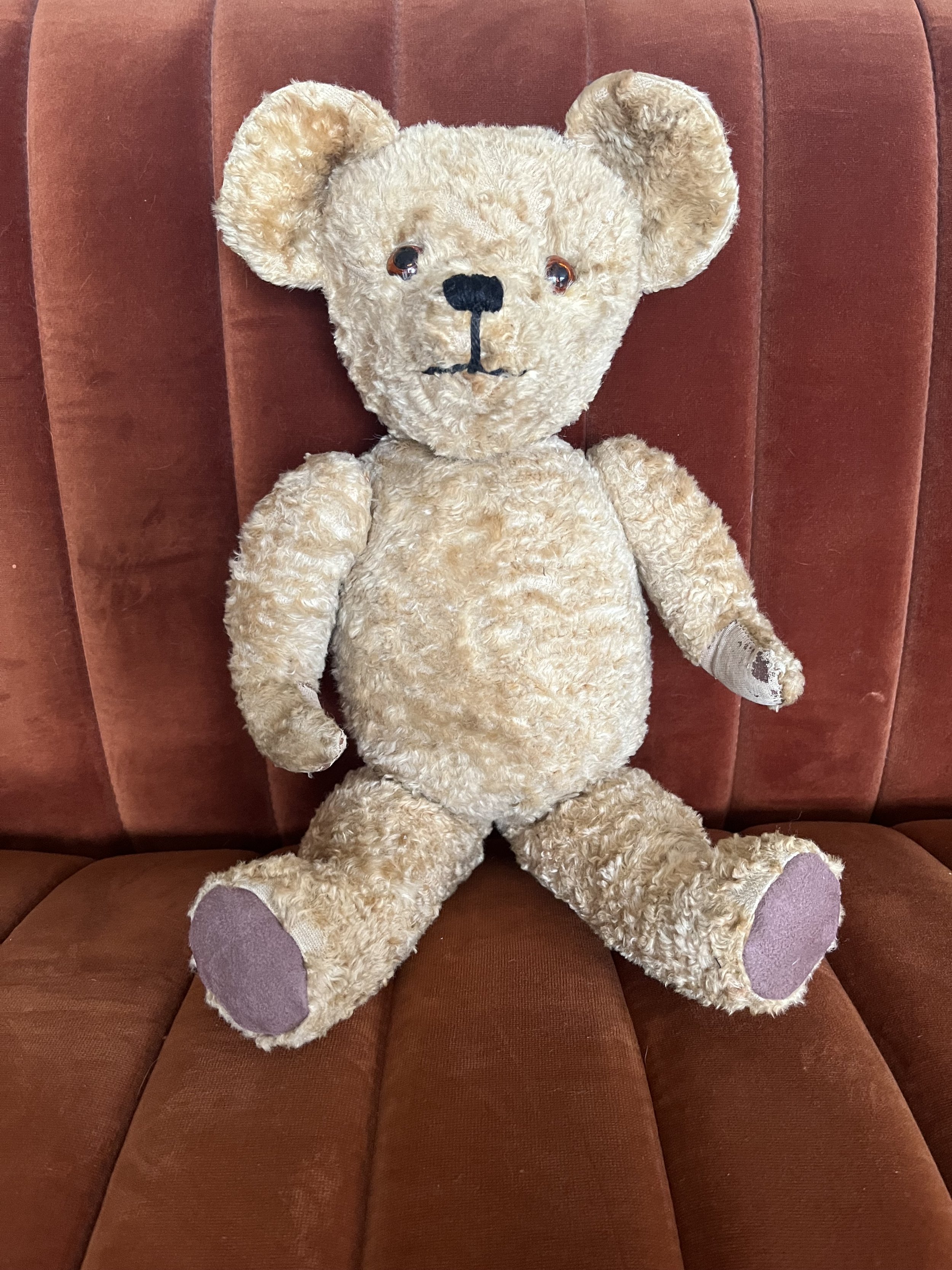 A vintage teddy bear fully repaired and restored