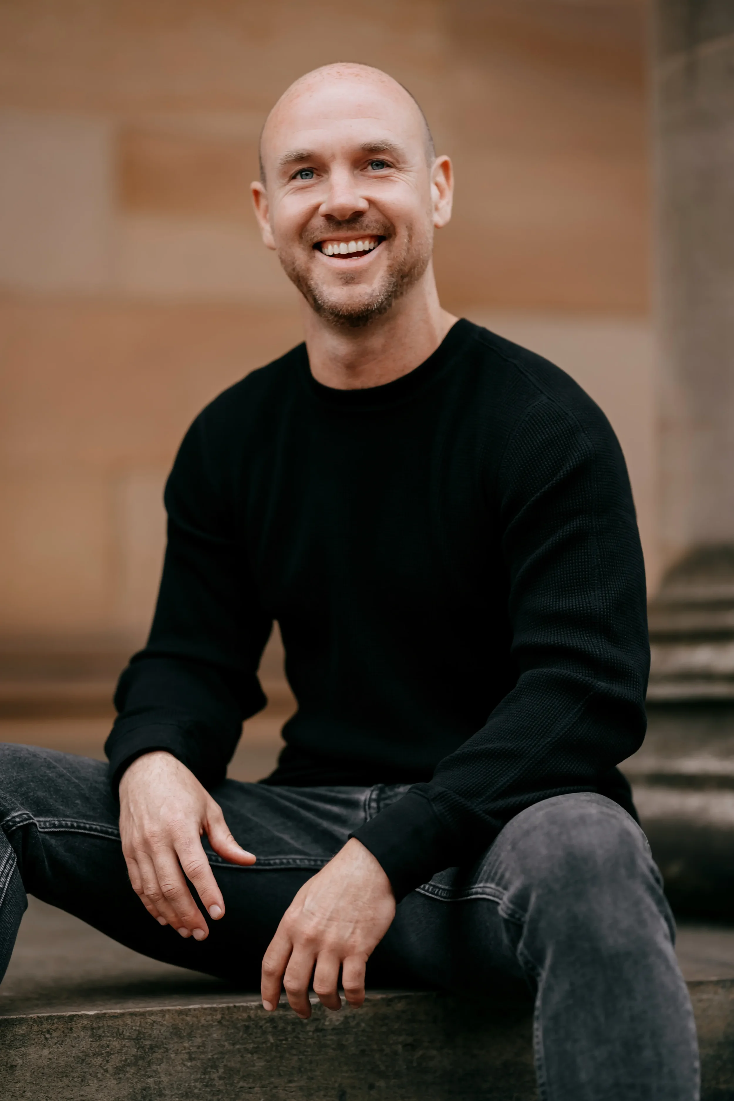 Paul Holmes Chiropractor Sitting on Steps in Edinburgh